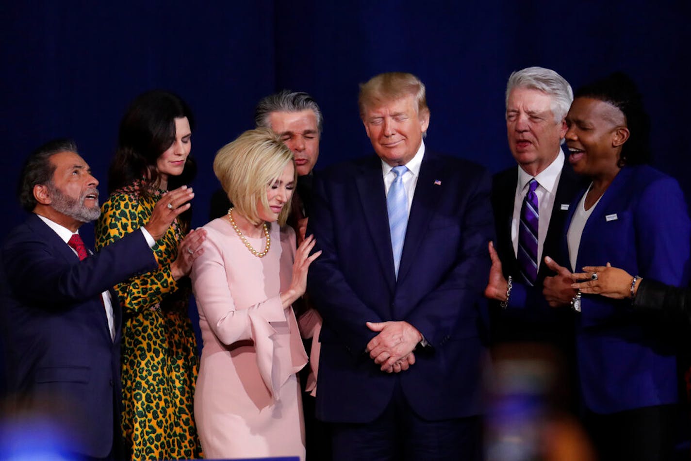 Faith leaders prayed with President Donald Trump during a rally for evangelical supporters at the King Jesus International Ministry church in Miami on Jan. 3, 2020.