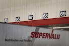 The Supervalu Inc. logo is displayed on a truck at a distribution center in Hopkins.