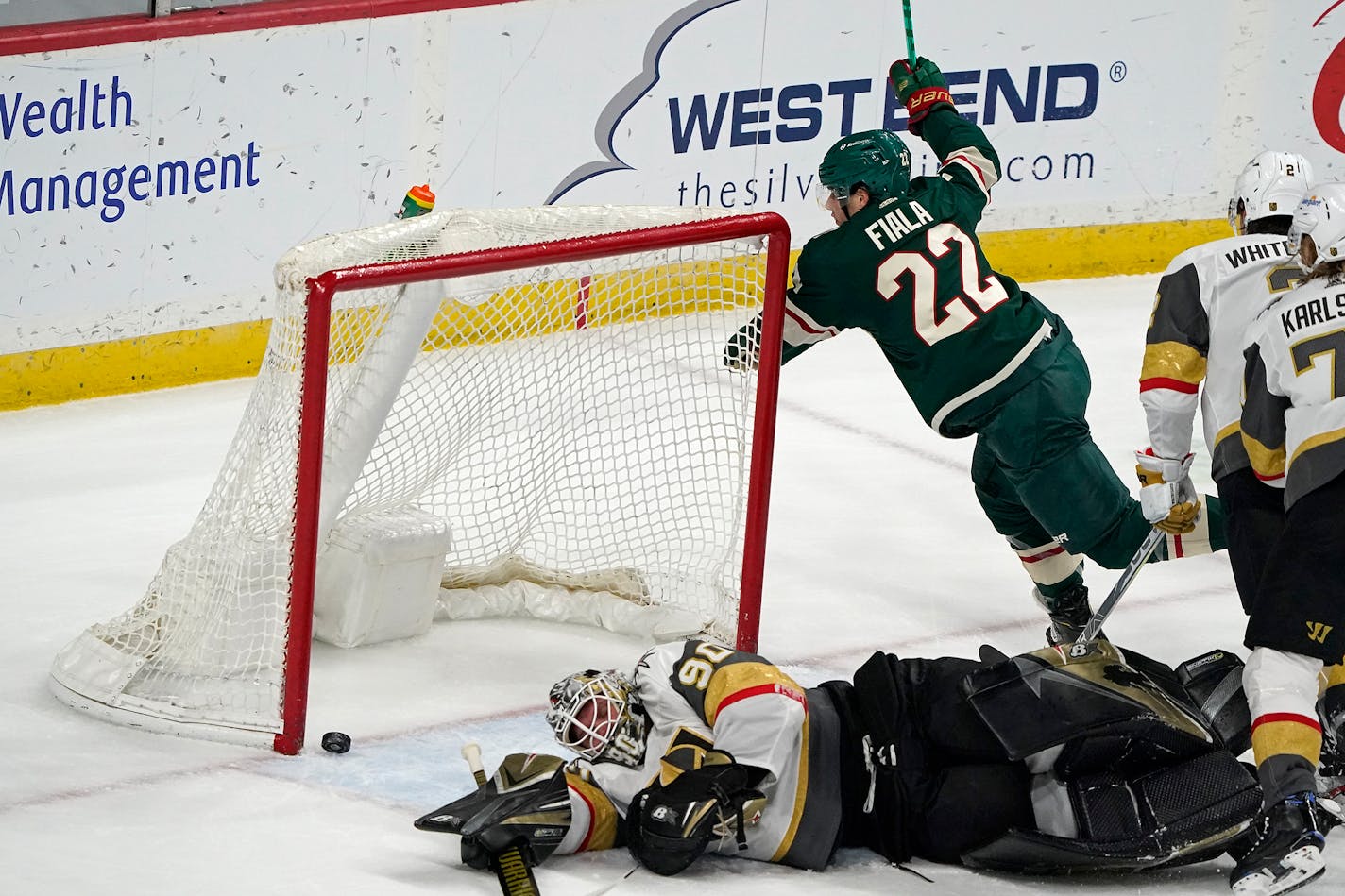 Kevin Fiala celebrated Kirill Kaprizov's game-tying goal past Vegas Golden Knights goaltender Robin Lehner on Monday night.