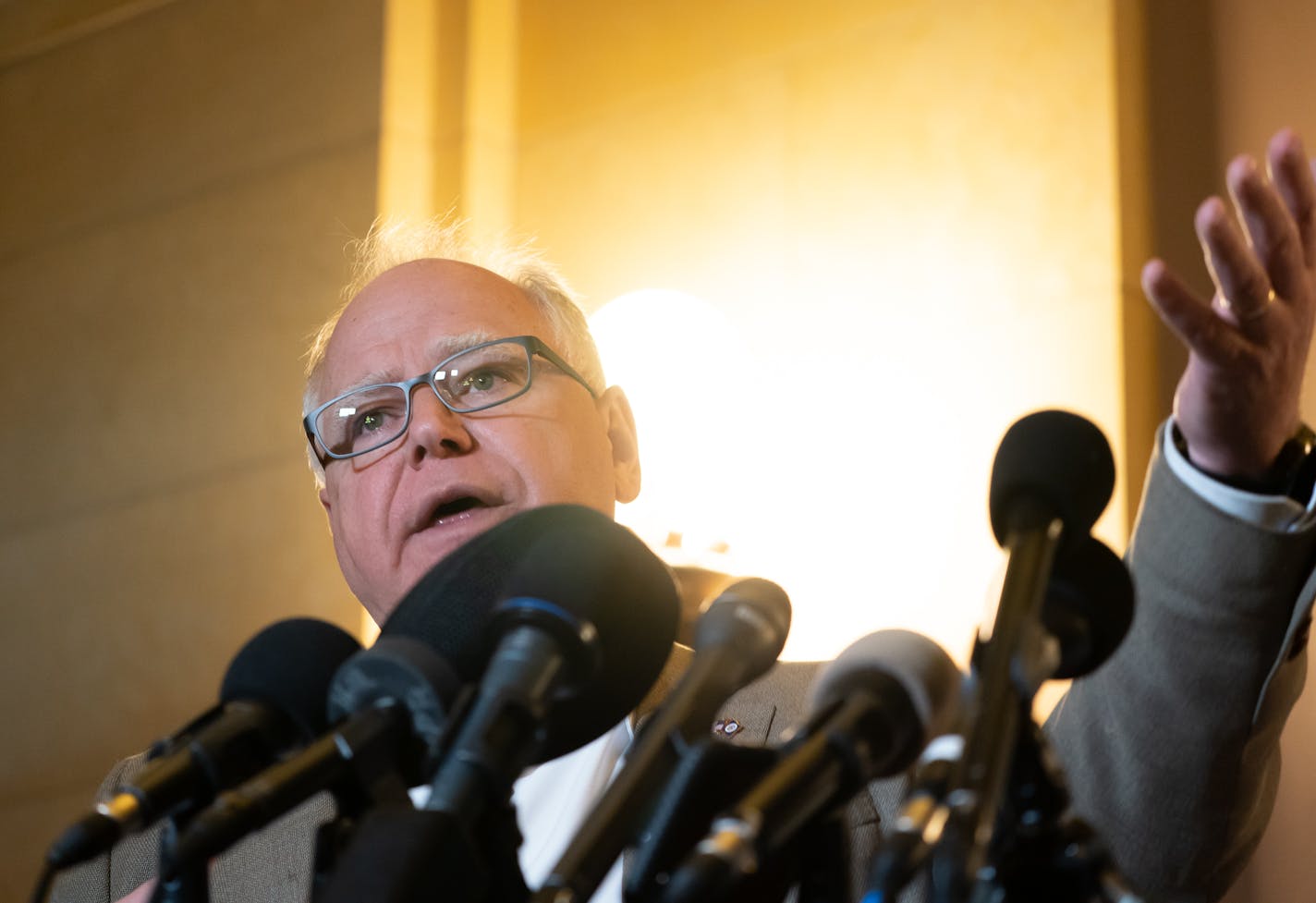 Governor Tim Walz and Lt Governor Peggy Flanagan spoke at a press conference inside the Minnesota State Capitol to talk about the reopening of the Capitol and budget surplus. A School Choice group gathered around him holding their signs.