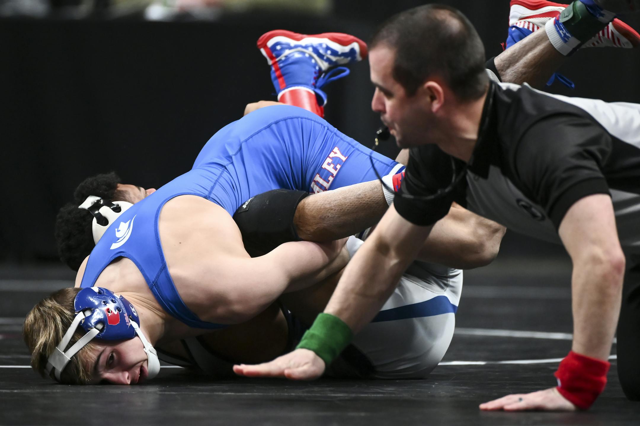 Please combo cut the 2 photos here ... Simley's Chase DeBlaere pinned Hibbing's Francis Huenffinger in a Class 2A 120lb quarterfinal match Friday. ] Aaron Lavinsky ¥ aaron.lavinsky@startribune.com