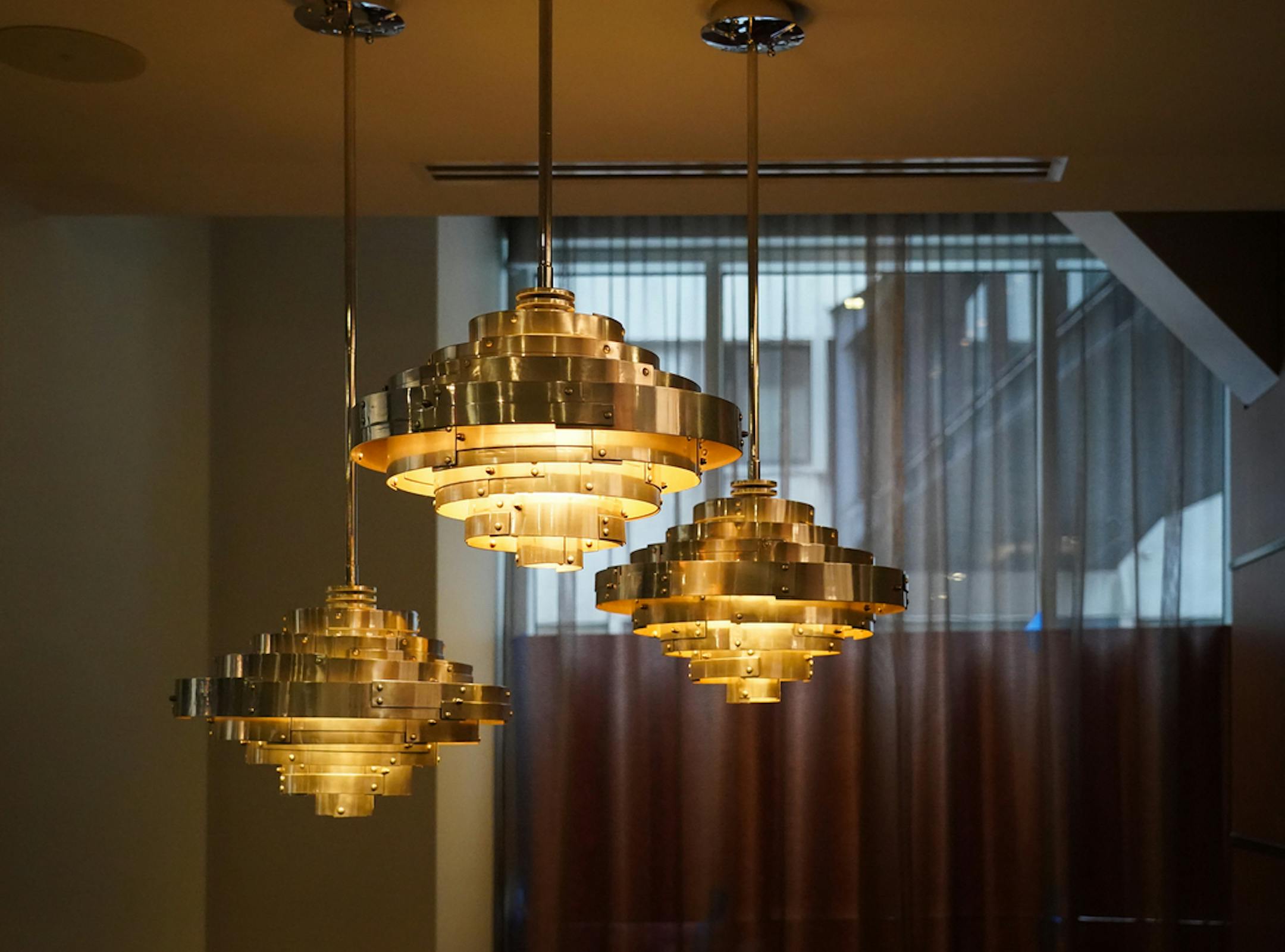 Light fixtures above a seating area on the main floor.