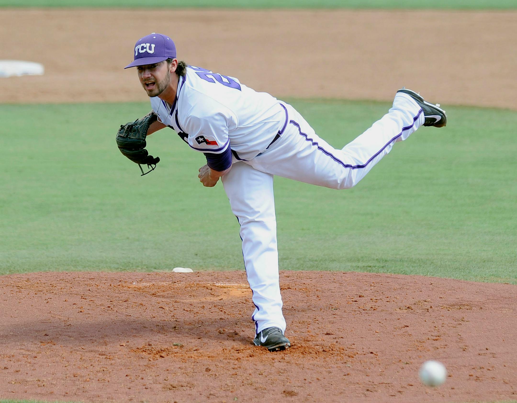 TCU pitcher Brandon Finnegan throws in the third inning of an NCAA college baseball super regional game against Pepperdine in Fort Worth, Saturday, June 7, 2014. (AP Photo/Matt Strasen)