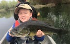 Joshua Nguyen, a 6-year-old from Apple Valley, caught this 5-pound, 20-inch largemouth bass while fishing with his father on an undisclosed lake in th