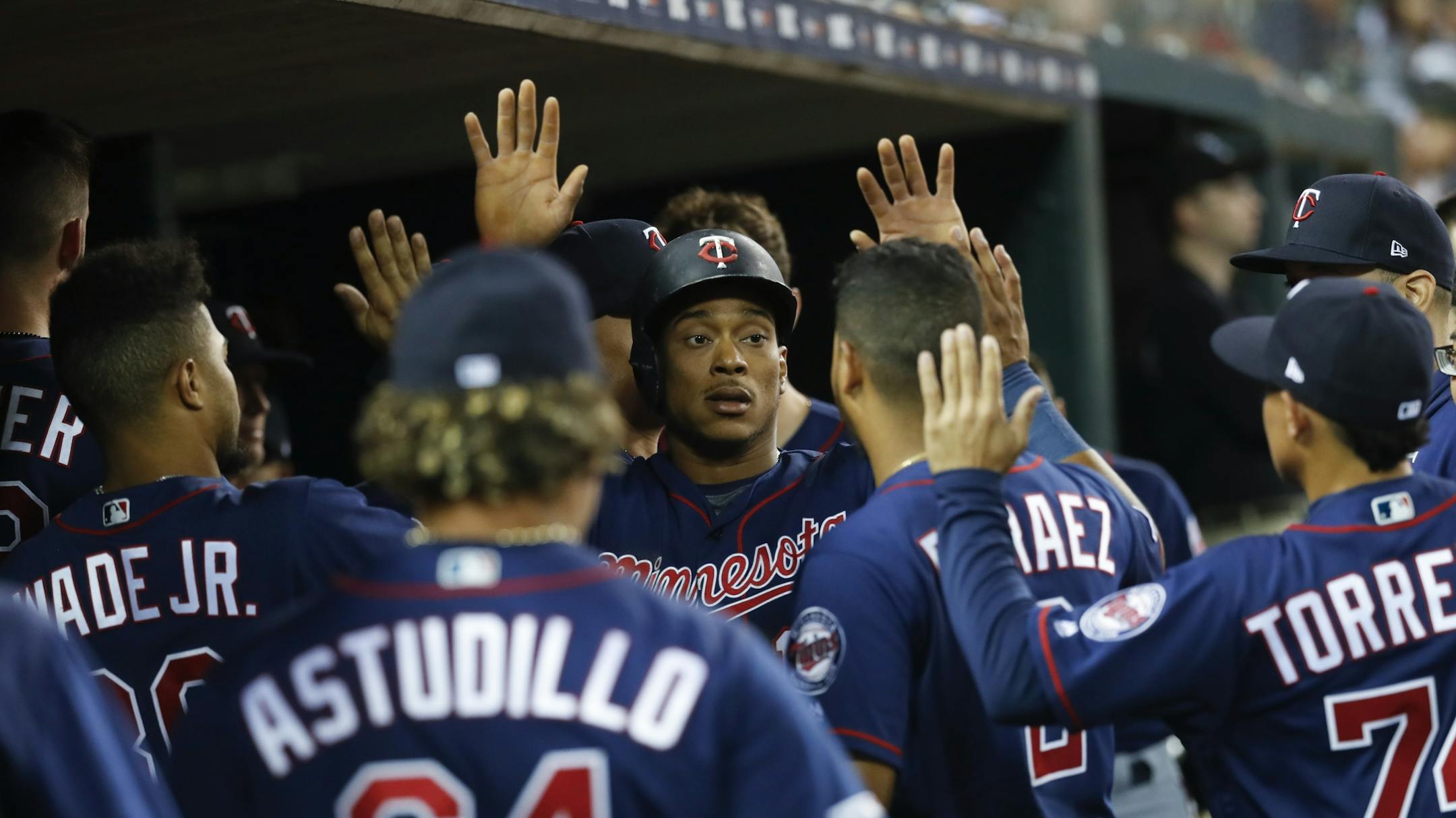 Minnesota Twins' Jorge Polanco celebrates scoring in the eighth inning of a baseball game against the Detroit Tigers in Detroit, Wednesday, Sept. 25, 2019.