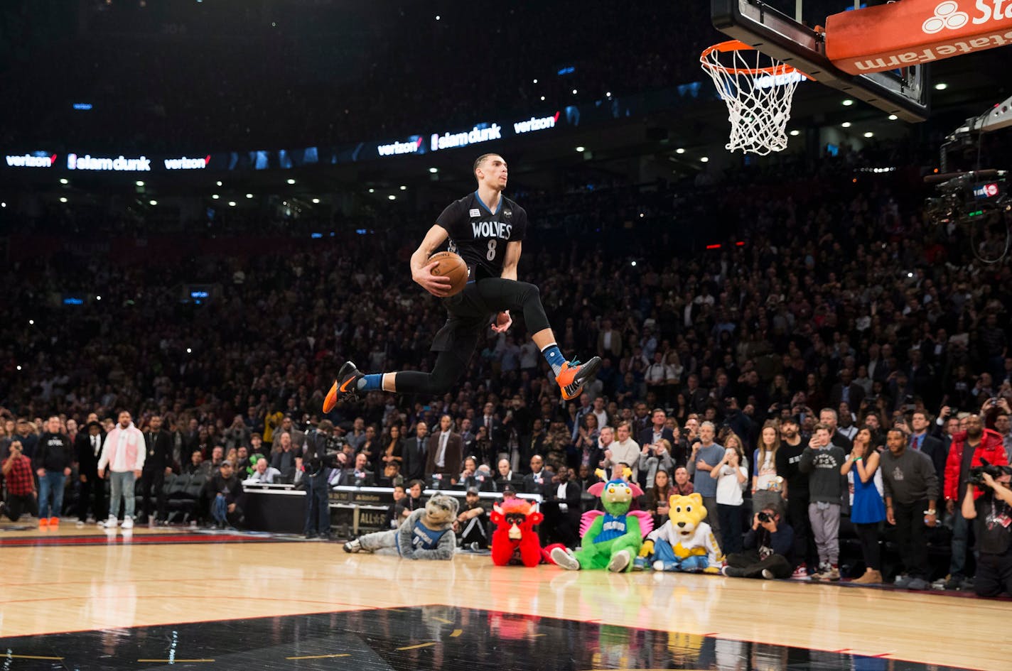 Minnesota Timberwolves' Zach LaVine slam dunks the ball during the NBA all-star skills competition in Toronto on Saturday, Feb. 13, 2016. (Mark Blinch/The Canadian Press via AP) MANDATORY CREDIT