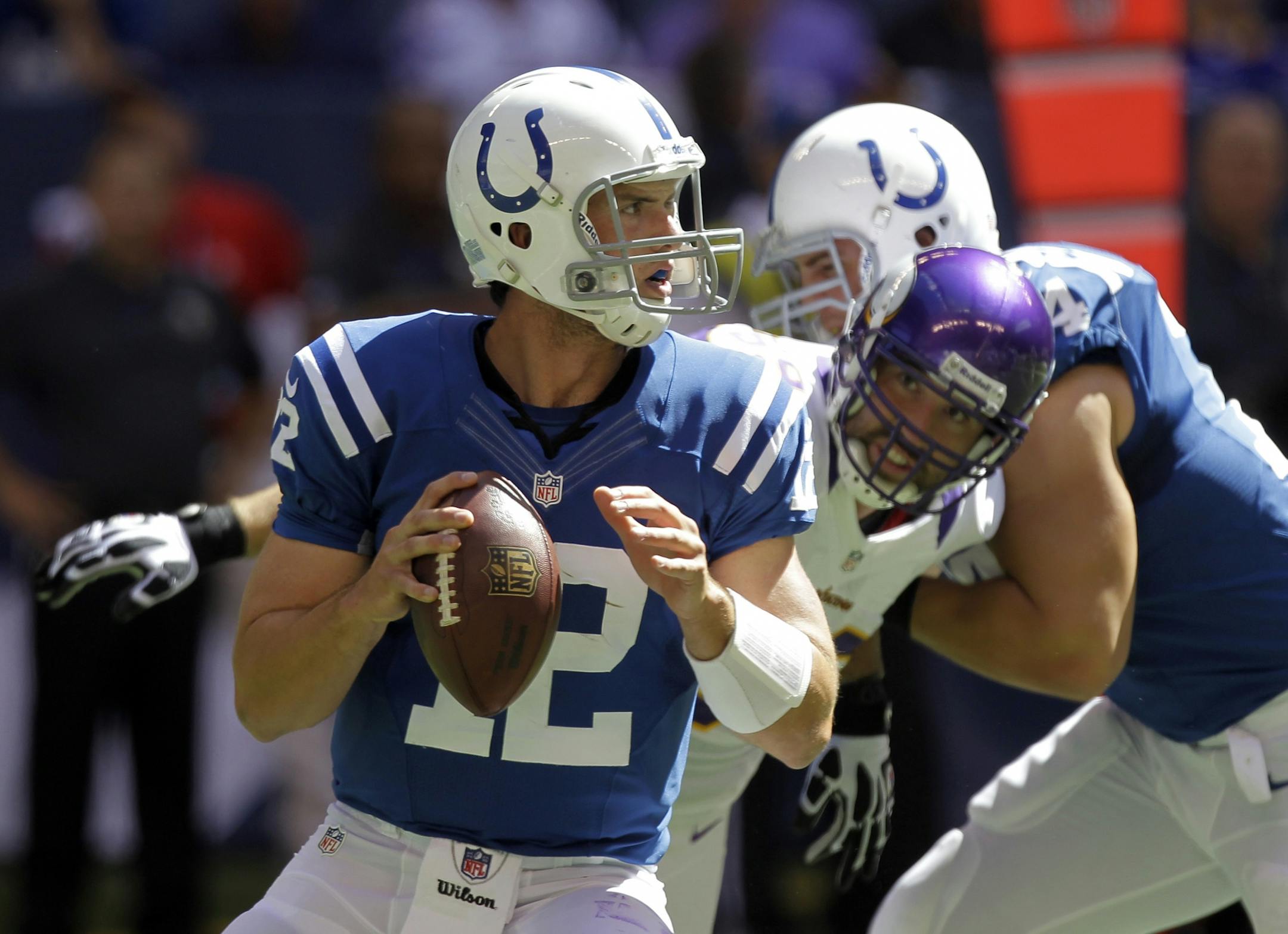 Andrew Luck looks to pass.