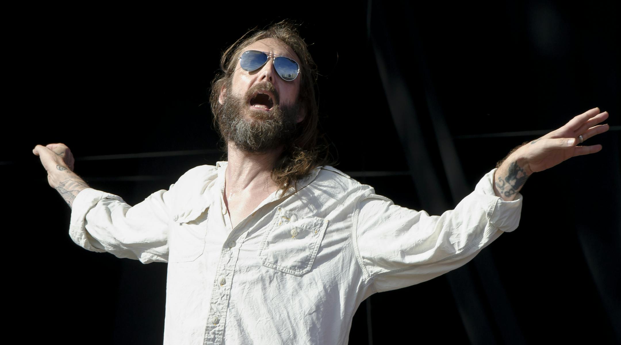 Chris Robinson from U.S band, The Black Crowes performs at the Hard Rock Calling Festival in the Queen Elizabeth Olympic Park, London, Sunday, June 30, 2013. (Photo by Jonathan Short/Invision/AP) ORG XMIT: NYOTK