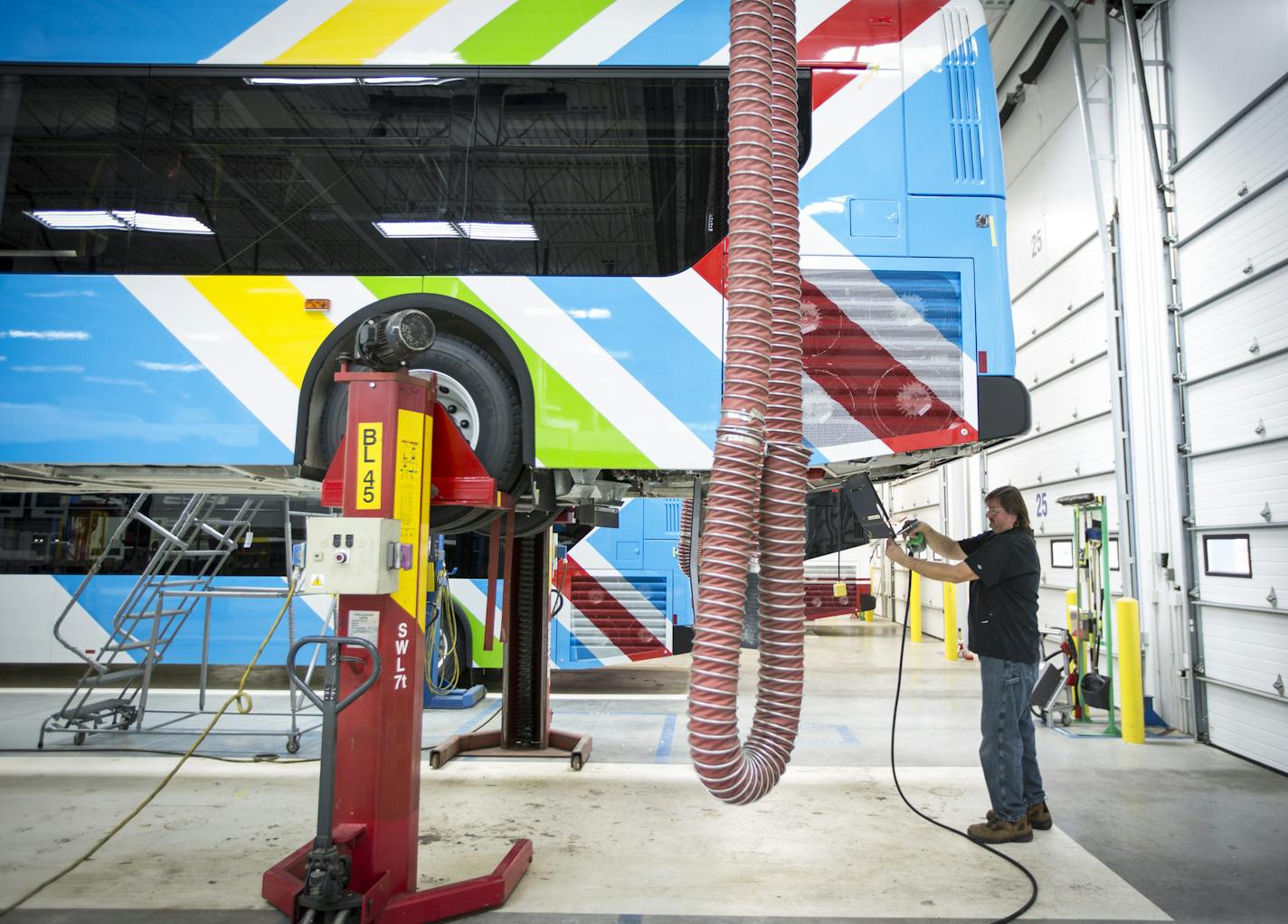 Arnie Schmit worked on the finishing touches on a bus heading to Fort McMurray, Canada, at New Flyer on Monday, November 30, 2015, in St. Cloud, Minn. ] RENEE JONES SCHNEIDER &#x2022; reneejones@startribune.com