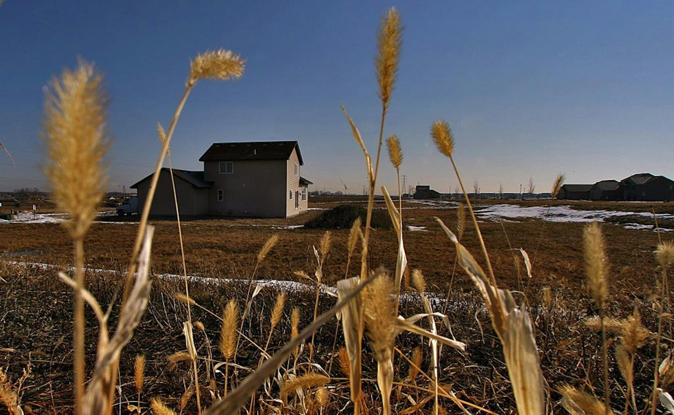 A home under construction was surrounded by lots for sale along Hackney Ave. in a subdivision in Shakopee.