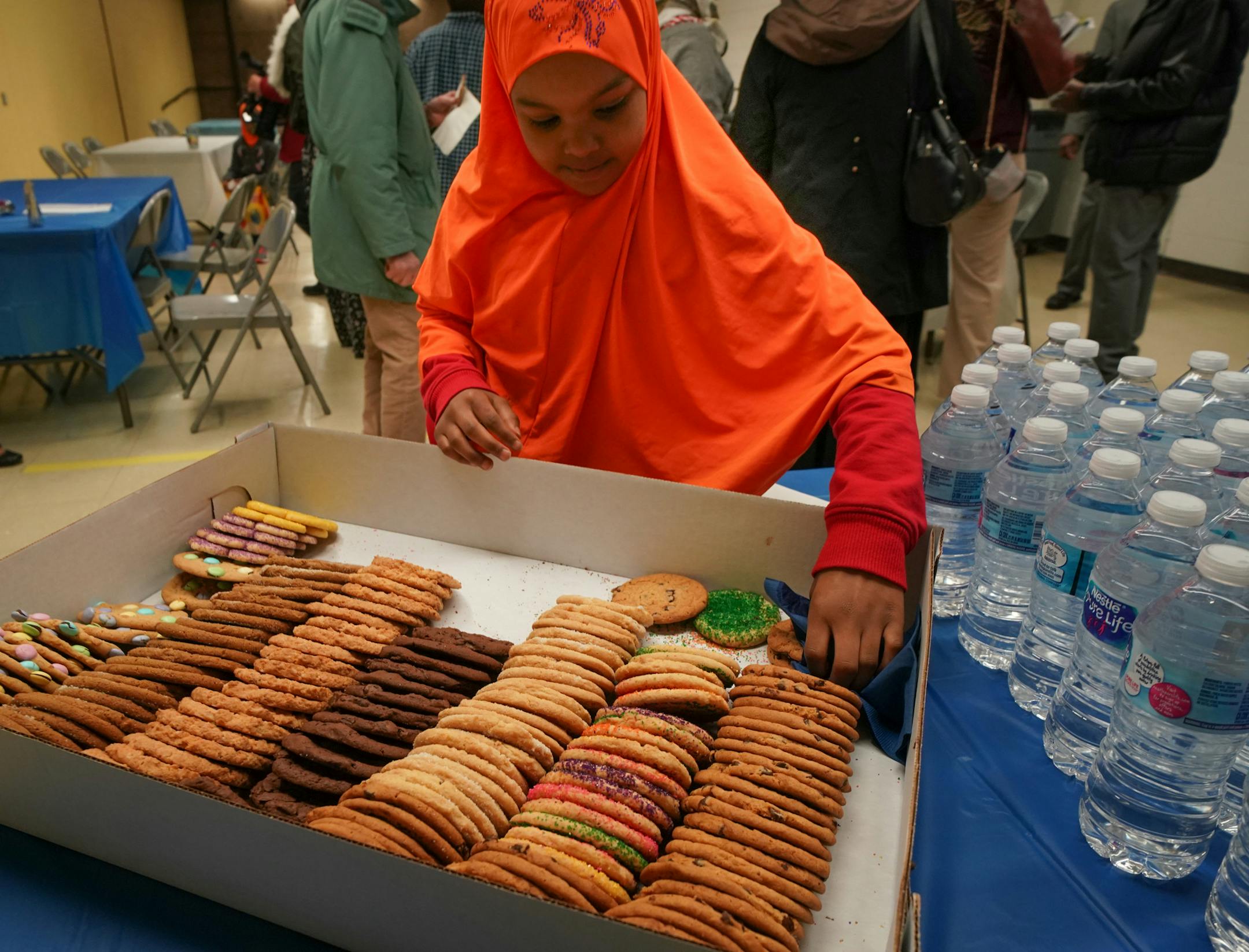 Sulekha Khalif, 9, took a cookie at the grand opening ceremony. The Highwood Hills Recreation Center on St. Paul's East Side, which has been closed for a decade, reopened Monday. ] GLEN STUBBE • glen.stubbe@startribune.com Monday, April 1, 2019 After a decade-long closure, the Highwood Hills Recreation Center on St. Paul's East Side will reopen Monday. The closure was an effort to save money as the city struggled to stave off the effects of the recession, but Council Member Jane Prince, w
