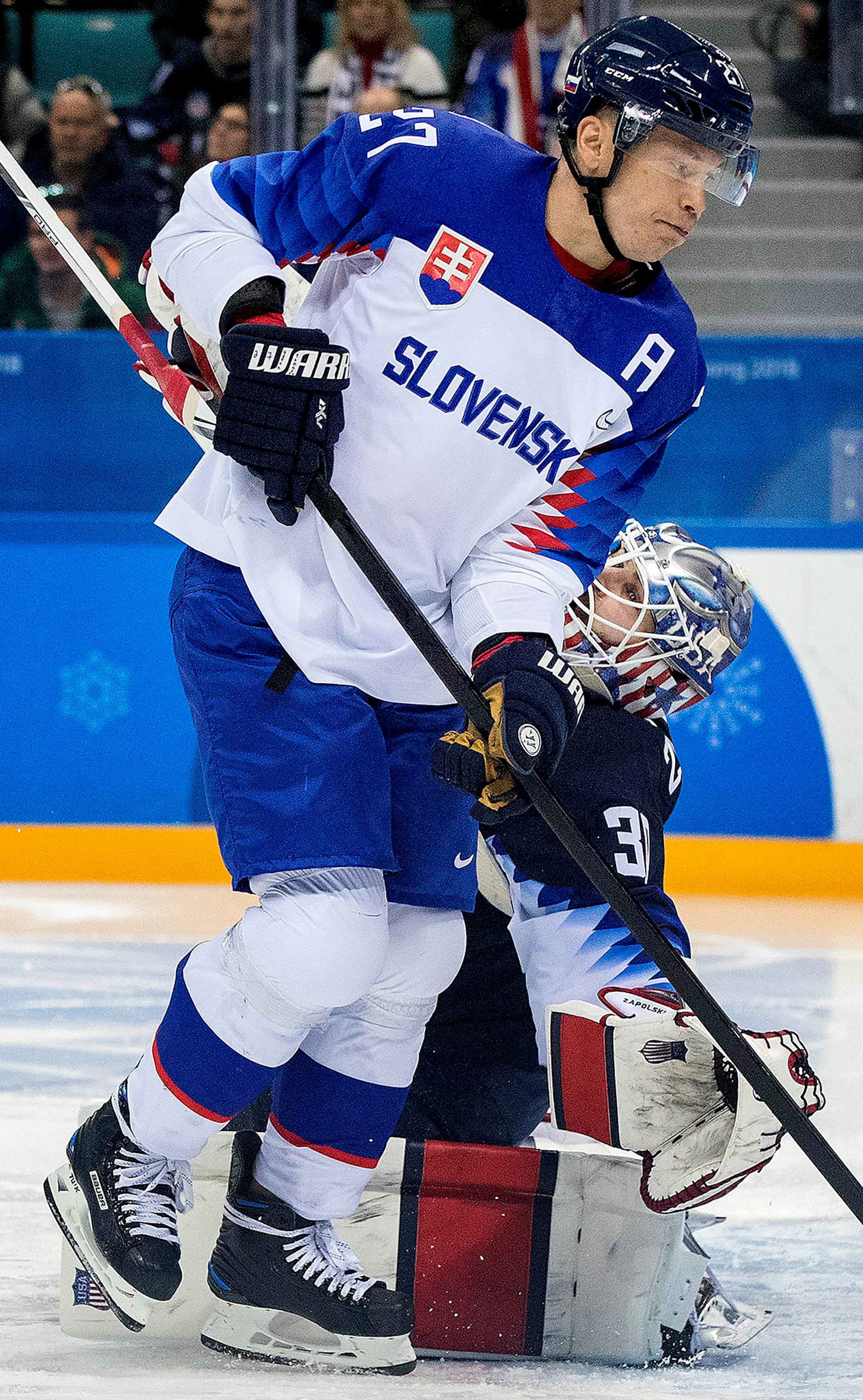 Ladislav Nagy (27) collided with USA goalie Ryan Zapolski (30) in the second period. Nagy was called for interference on the play.