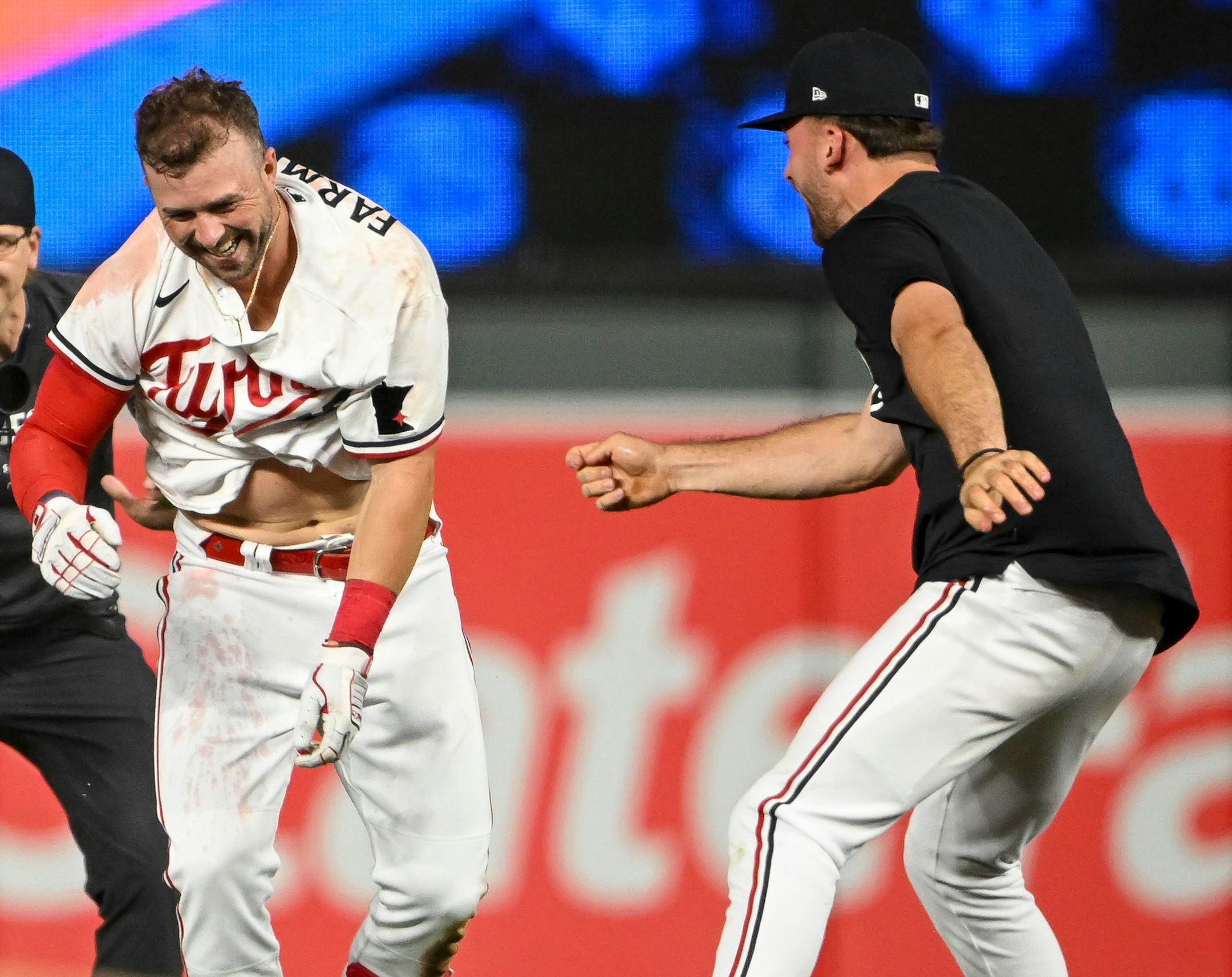 Teammates celebrate with Minnesota Twins third baseman Kyle Farmer (12) after Farmer's walk-off single in the bottom of the 10th inning against the Boston Red Sox Wednesday, June 21, 2023, at Target Field in Minneapolis, Minn.