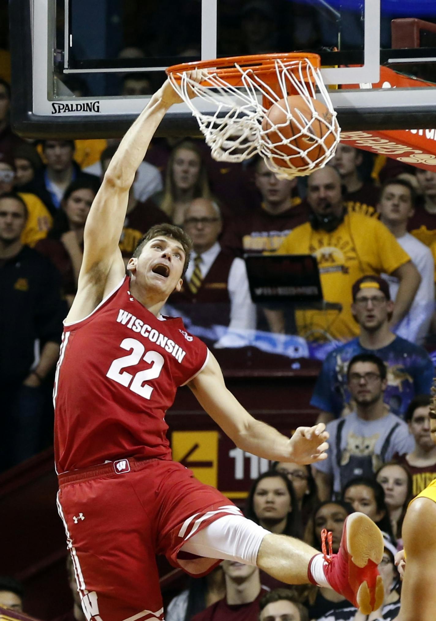 Wisconsin's Ethan Happ dunks against Minnesota during the second half of an NCAA college basketball game Saturday, Jan. 21, 2017, in Minneapolis.