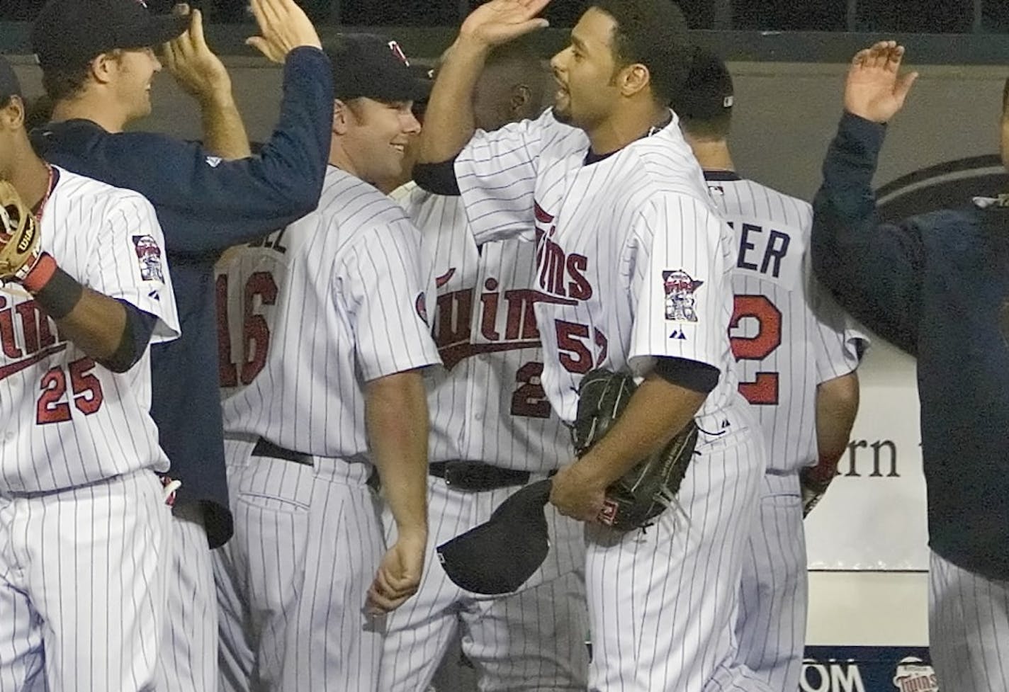 Johan Santana was greeted by teammates after the eighth inning of his 17-strrikeout game vs. Texas in 2007.