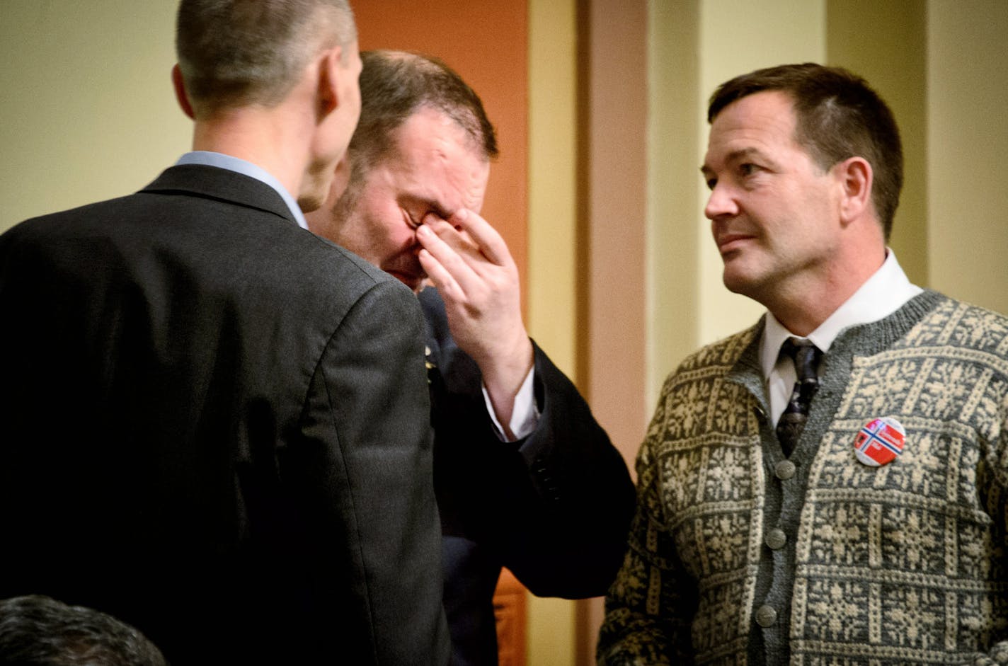 Rep. Dan Schoen was brought to tears after the medical marijuana bill passed the House. On the left is Rep. Rod Hamilton and right, Rep. Leon Lillie, all supporters of the medical marijuana bill. ] Friday, May 16, 2014 GLEN STUBBE * gstubbe@startribune.com ORG XMIT: MIN1405162100370496