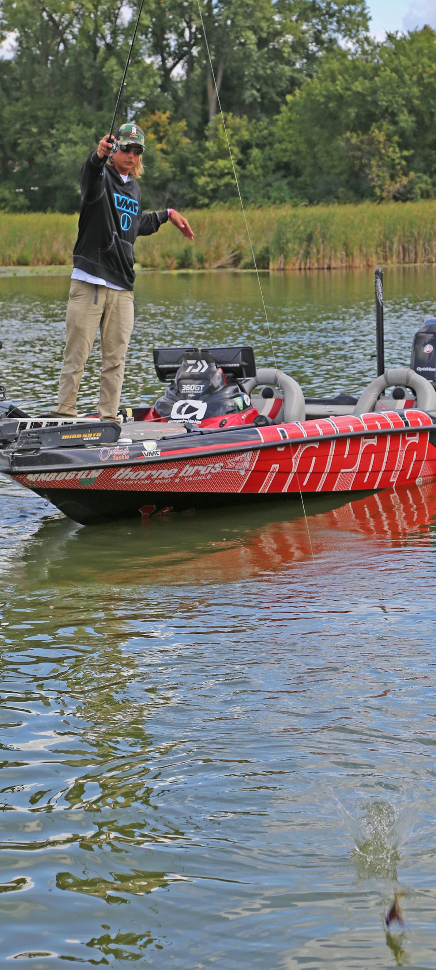 Seth Feider pitches a jig into Lake Minnetonka millfoil looking for largemouth bass. The Bassmaster Angler of the Year Tournament is on Mille Lacs beginning next week, a contest that Feider won last year on the same lake.