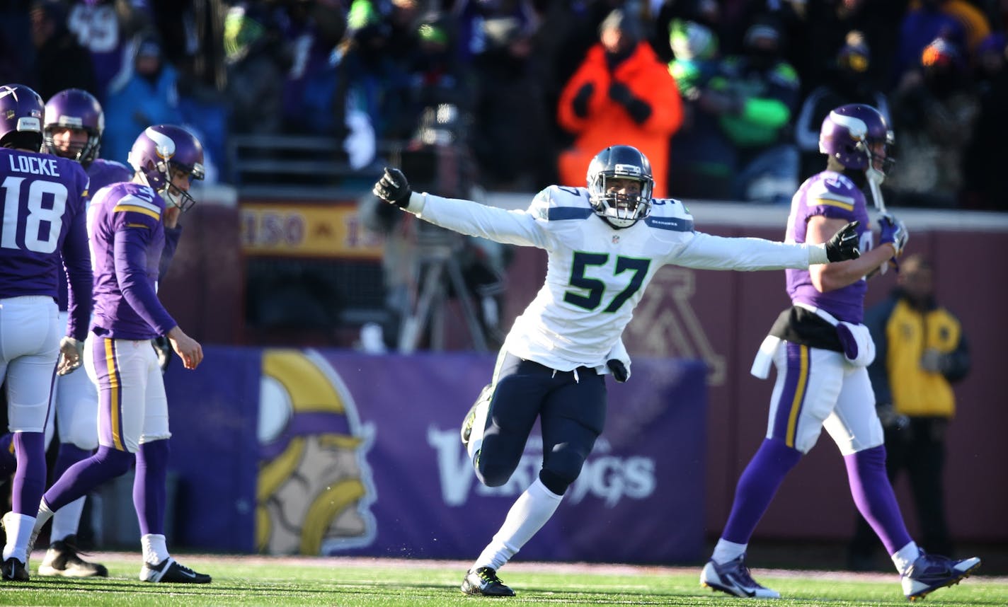 A dejected Minnesota Vikings kicker Blair Walsh (3) left walked off the field after missing a 27 yard field goal as Seattle Seahawks outside linebacker Mike Morgan (57) celebrated at TCF Bank Stadium Sunday January 10, 2016 in Minneapolis, MN.