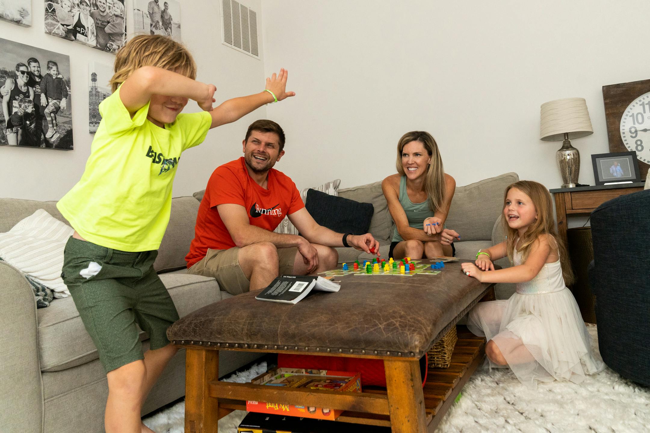 Thomas D'Amato, 7, breaks out into a dance move as he plays a game with his dad Anthony D'Amato, his mom Keira D'Amato, and sister Quin D'Amato,