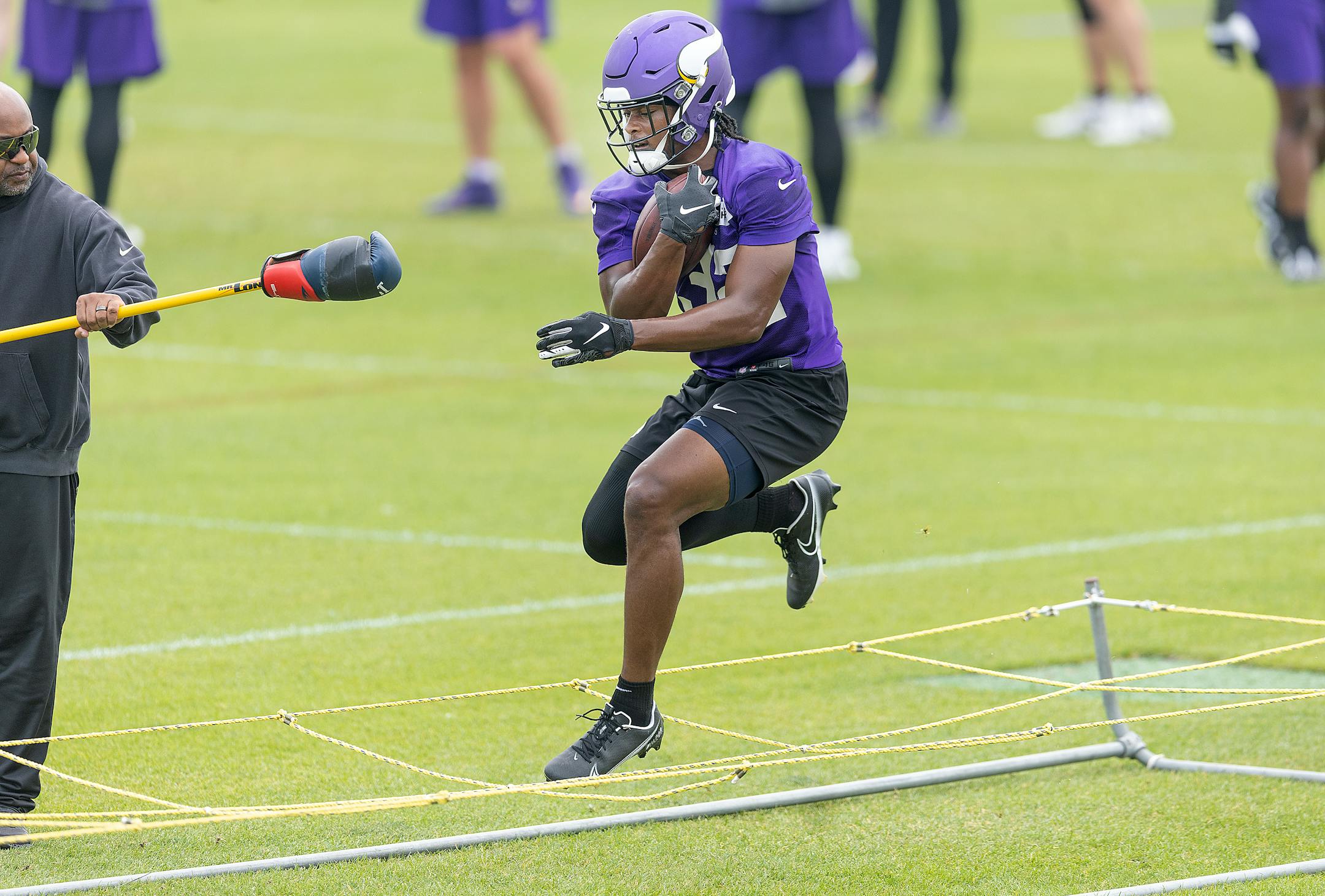 Vikings running back Ty Chandler runs through drills during practice at the TCO Performance Center in Eagan, Minn., on Tuesday, June 6, 2023.