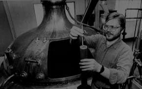 Beer maker Mark Stutrud, president and head brewer of Summit Brewing Co. in St. Paul, checks on the production of a batch of Summit Extra Pale Ale in 