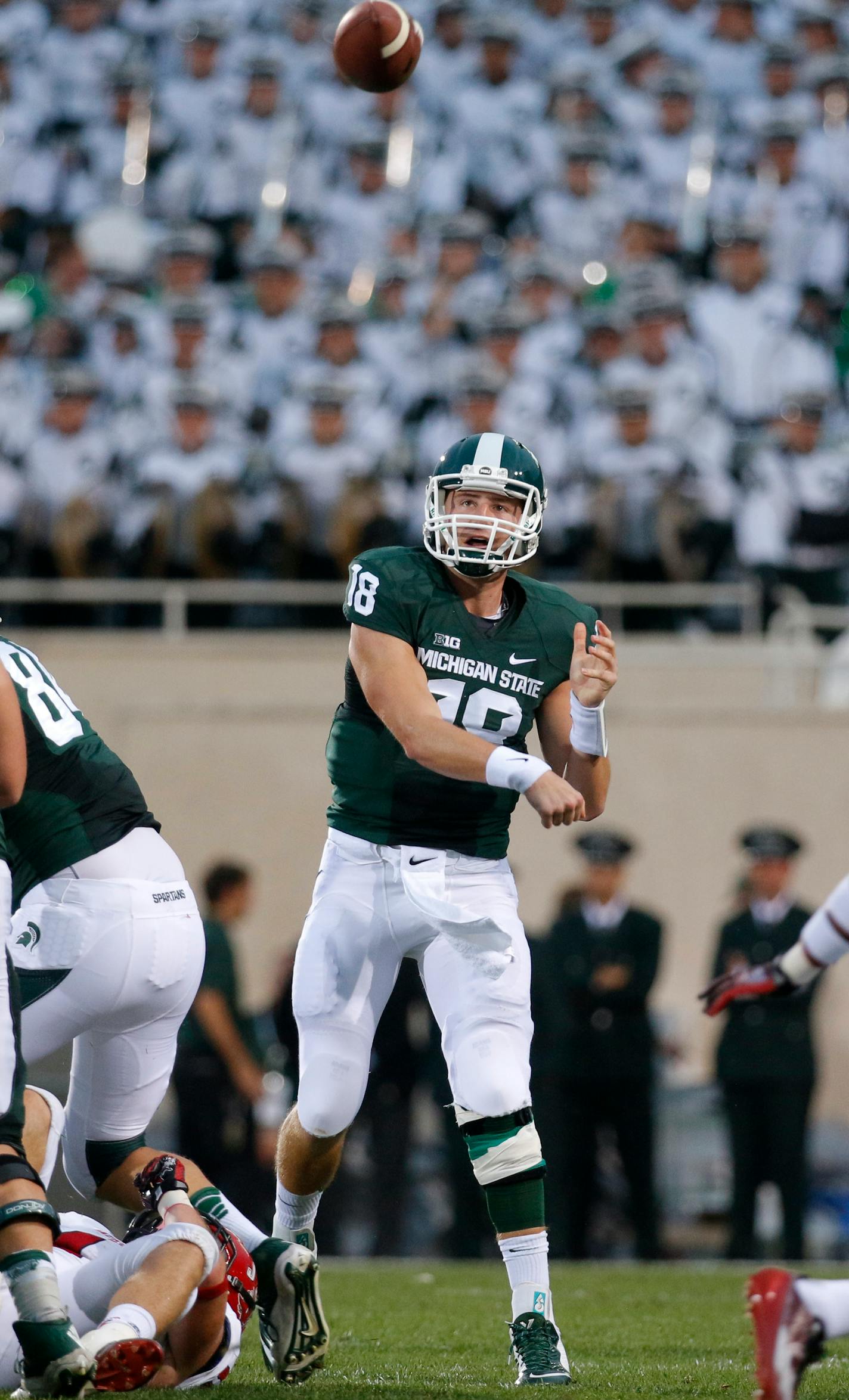 Michigan State quarterback Connor Cook throws a pass against Jacksonville State during the first quarter of an NCAA college football game, Friday, Aug. 29, 2014, in East Lansing, Mich. Michigan State won 45-7. (AP Photo/Al Goldis)