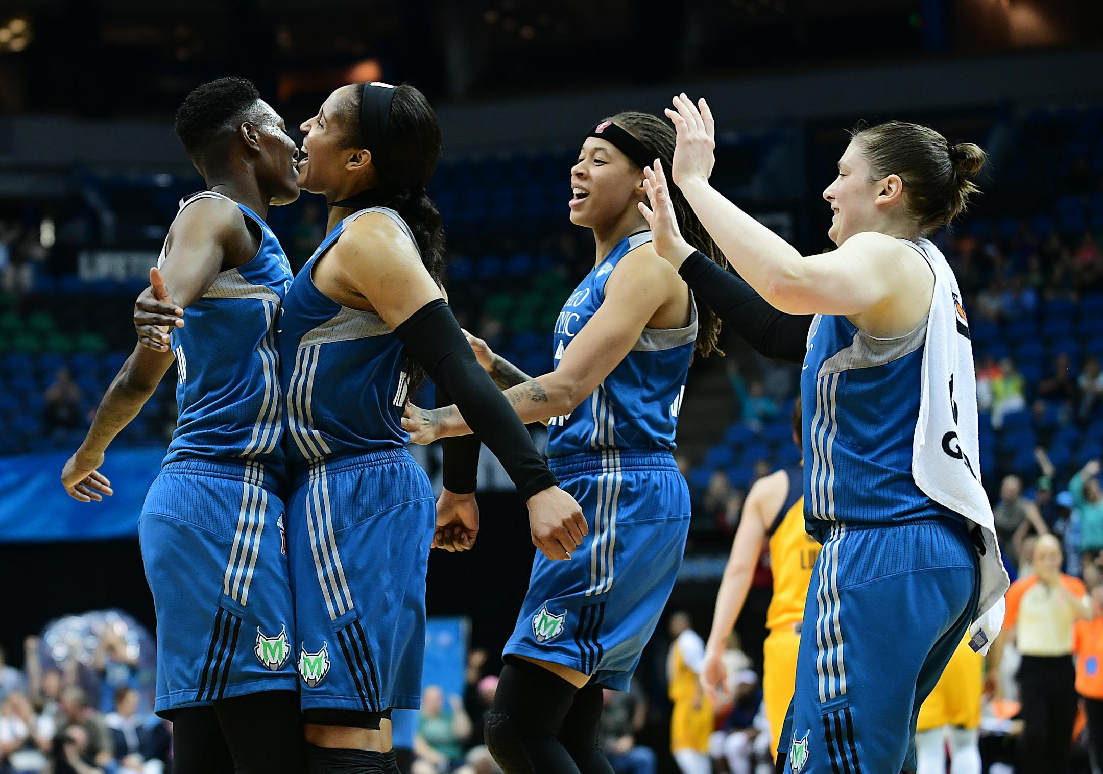 Minnesota Lynx forward Maya Moore (23) bumped chests with forward Natasha Howard (3) as guard Seimone Augustus (33) and guard Lindsay Whalen (13) joined the celebration during a game last week. The Lynx beat New York on Tuesday to reach 6-0.