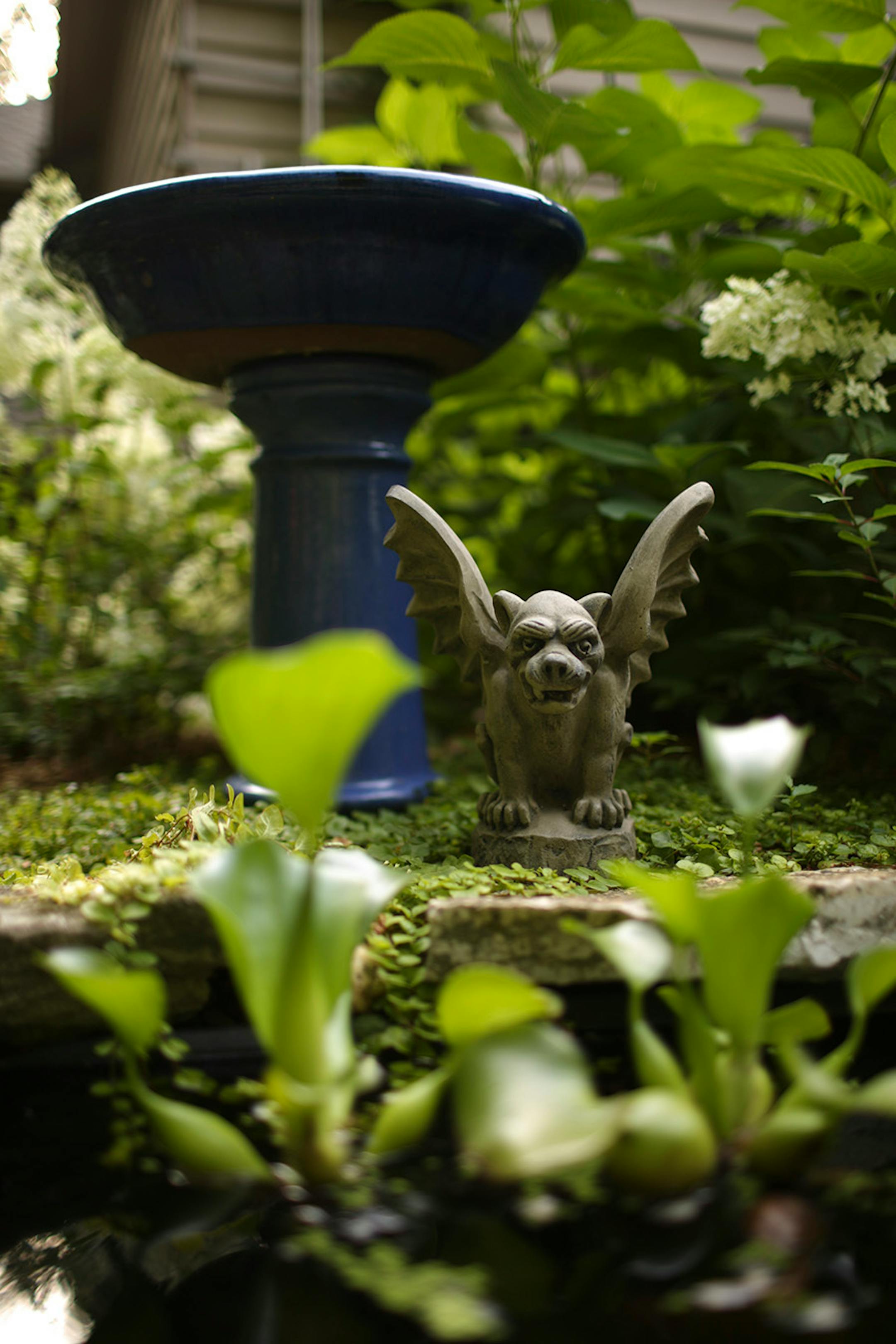A winged creature stood guard over a water feature.