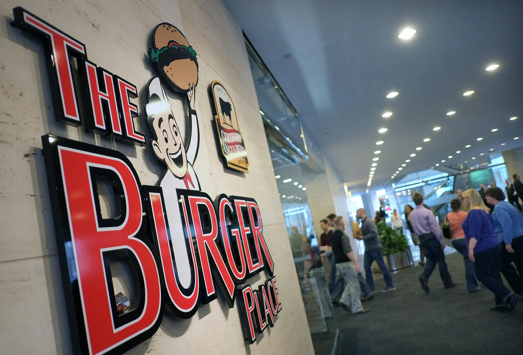 The Burger Place signage. ] TOM WALLACE &#x2022; twallace@startribune.com _ Assignments #20027783A_ February 23, 2013_ SLUG: 355643 RN022813_ EXTRA INFORMATION: Minneapolis eats, with a variety of food, settings, and people using the skyway eateries to get them through the lunch hours. People: Jeff Burstein, owner of the classic Brothers Deli, 6th and Nicollet Places: One Two Three Sushi in the IDS Center (7th St. side), where they have a design-your-own sushi line. food: a stack of the beautifu