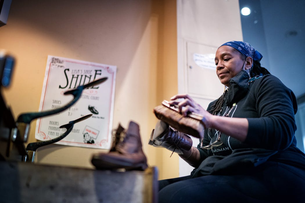 Lisa Cotton worked one of her final shifts in her shoeshine stand in the IDS Building before leaving her career behind. Her last day, Feb. 1, was the 31st anniversary of her first day on the job.