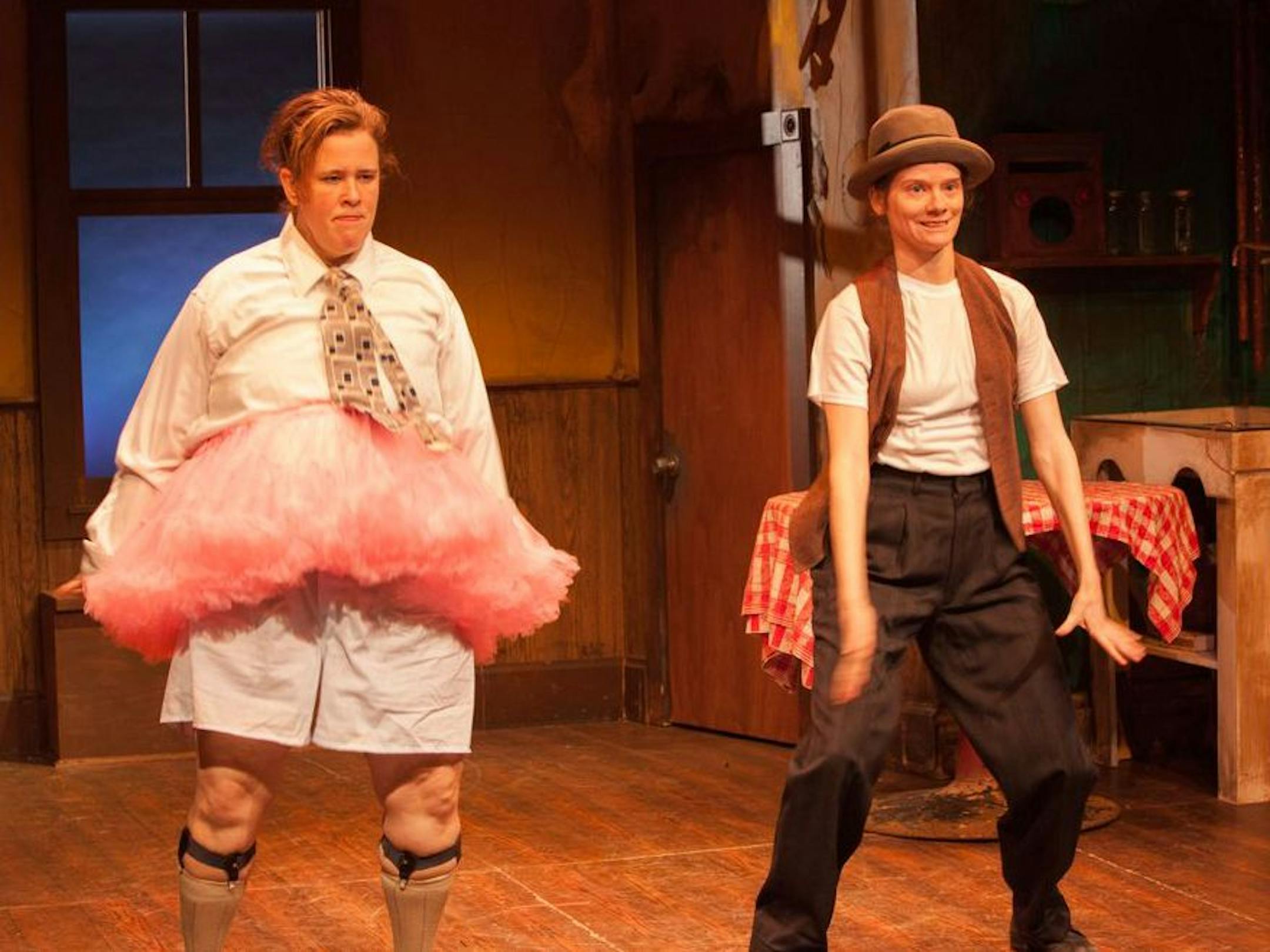 Maren Ward, left, portrays Ralph Kramden, and Kimberly Richardson puts her rubbery face to work as Ralph’s sidekick, Ed Norton, in "To the Moon" by Open Eye Figure Theatre.