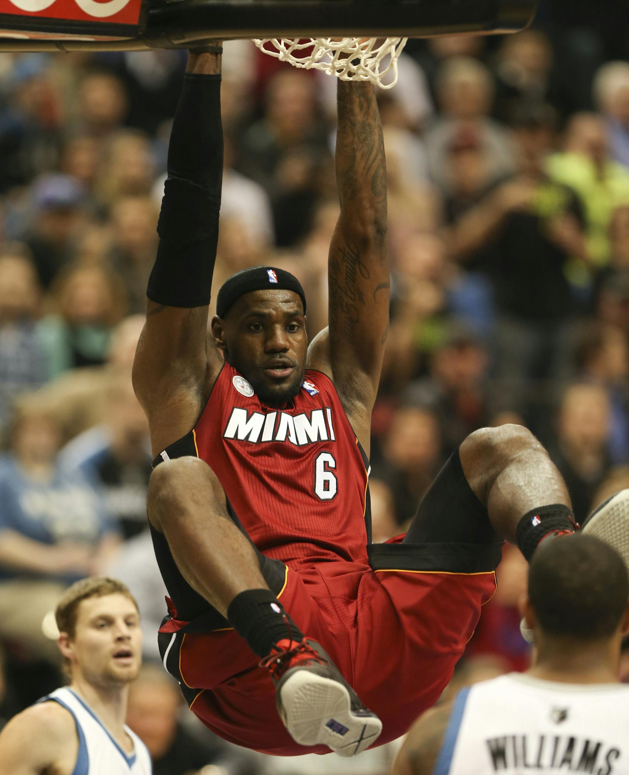 The Timberwolves lost to the Miami Heat 97-81 in an NBA game at Target Center in Minneapolis Monday night, March 4, 2013. Miami's LeBron James lingered on the rim after a first quarter dunk Monday night. ] JEFF WHEELER ‚Ä¢ jeff.wheeler@startribune.com