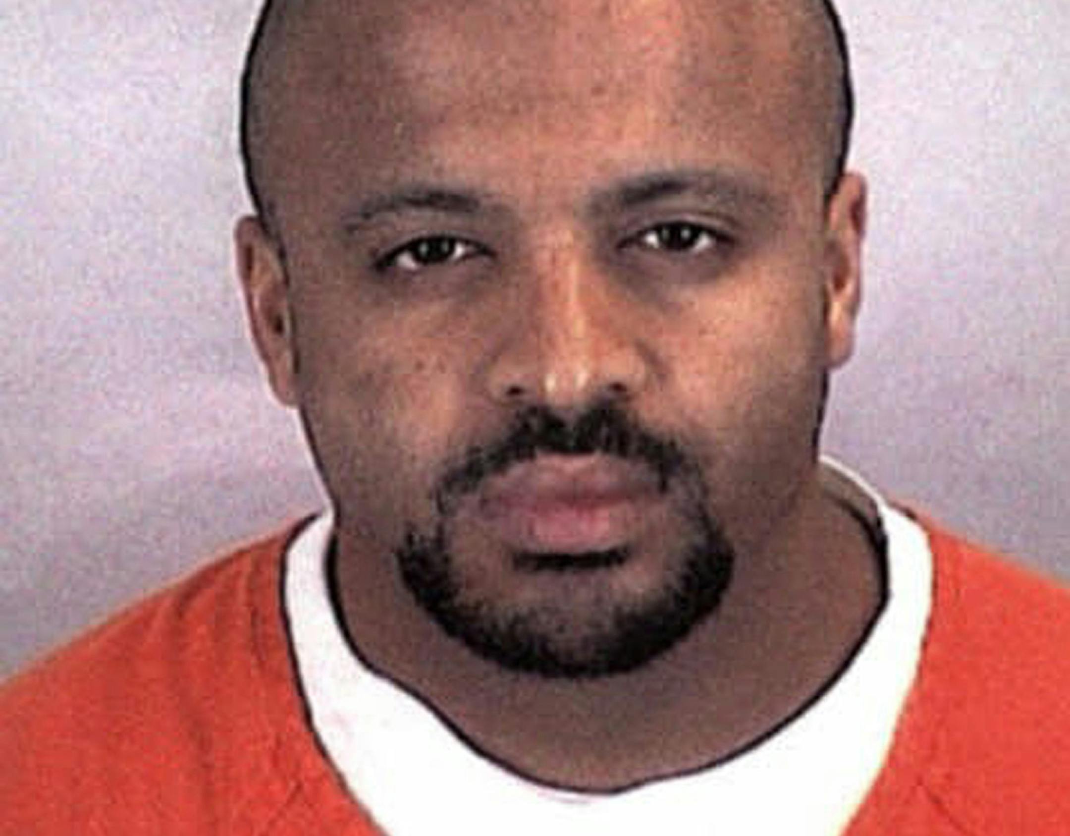 FILE - In this undated file photo provided by the Sherburne County Sheriff Office, Zacarias Moussaoui is shown. Moussaoui, known as the "20th hijacker" in the 9/11 terror attacks is asking a South Florida federal judge for a transfer to the military prison at Guantanamo Bay, Cuba. The request is part of a rambling, handwritten letter filed Wednesday, Dec. 10, 2014, in Miami federal court. He is serving a life prison sentence after pleading guilty in 2005 to conspiring with the Sept. 11 hijackers