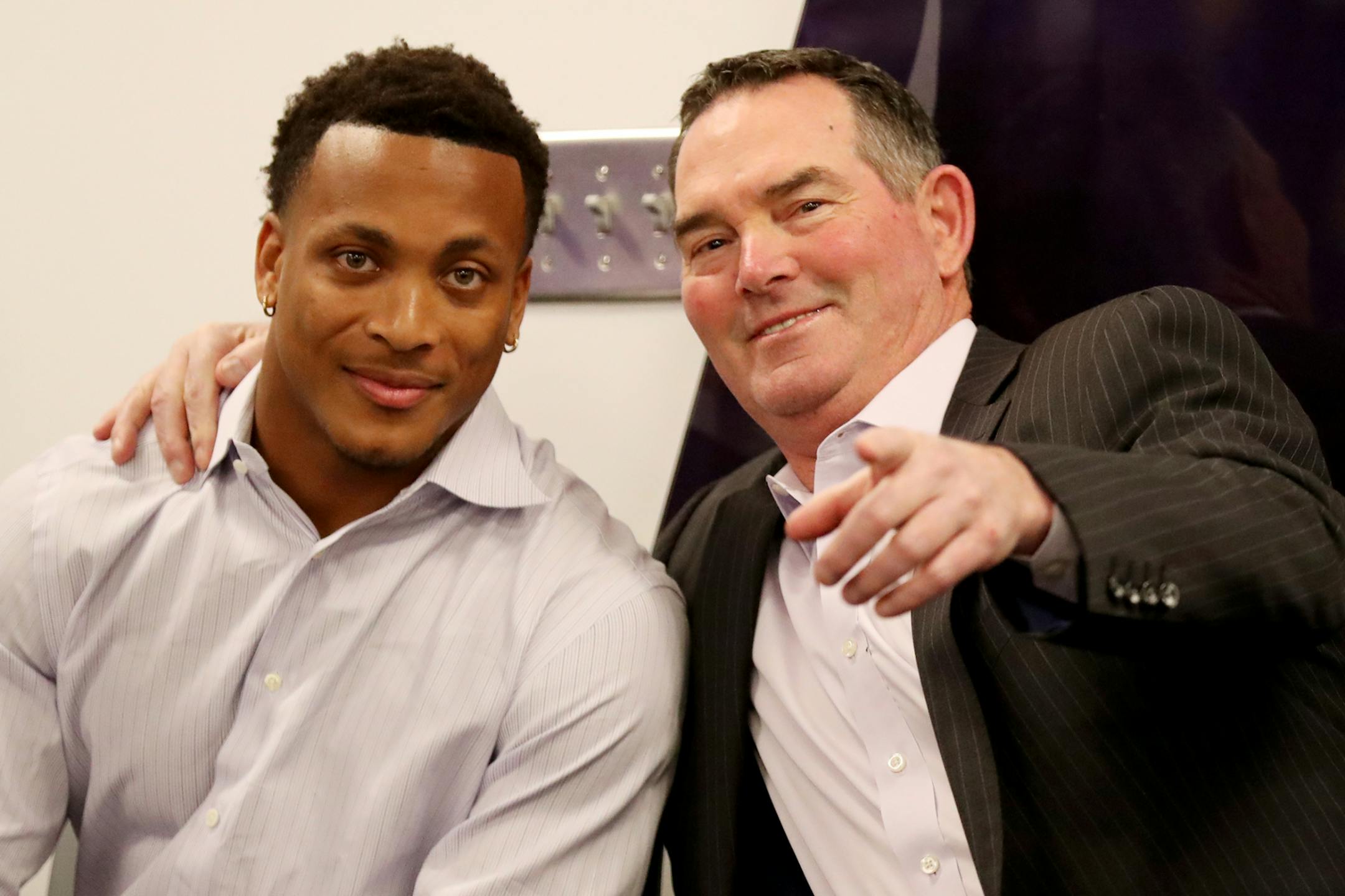 Before formally being introduced to local media members Minnesota Vikings first round pick cornerback Mike Hughes from the University of Central Florida is directed towards a camera by Vikings head coach Mike Zimmer Friday, April 27, 2018, at the Twin Cities Orthopedics Media Center.