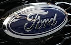 FILE - The Ford logo is seen on the grill of a Ford Explorer on display at the Pittsburgh International Auto Show in Pittsburgh, on Feb. 15, 2024. Two