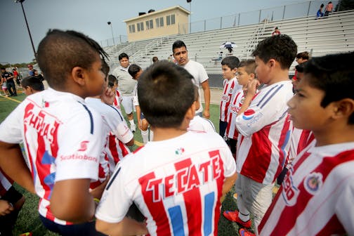 Angel Ramirez Diaz, center, gave his team "Chivitas,: a pep talk before their game during a soccer tournament, Saturday, August 29, 2015 at Holy Angels High School in Richfield, MN. Most of the team names come from actual team names in the Mexican Soccer League.