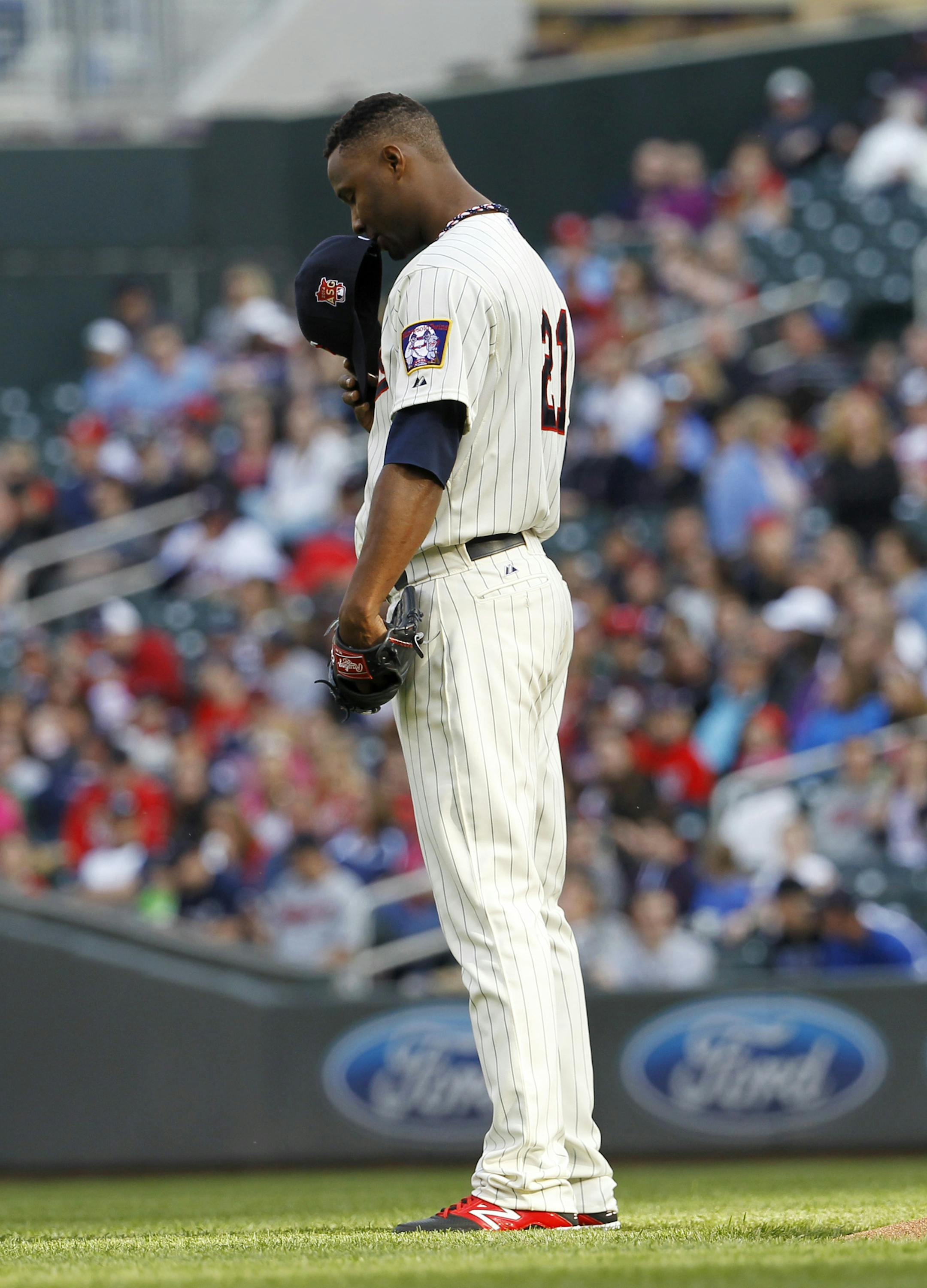 Minnesota Twins starting pitcher Samuel Deduno takes a moment before delivering to the Seattle Mariners during the first inning of a baseball game, Saturday, May 17, 2014, in Minneapolis. (AP Photo/Ann Heisenfelt)