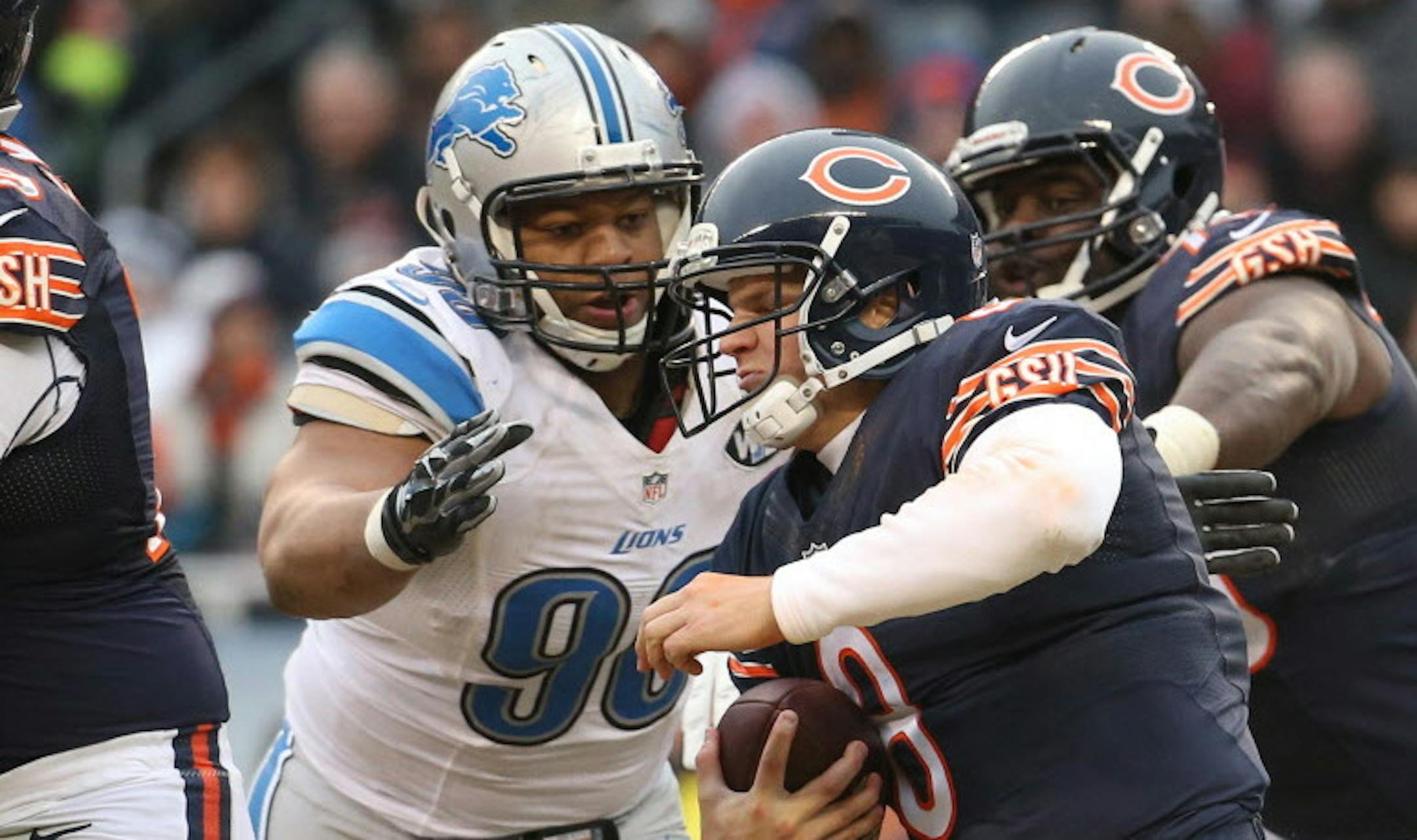 Detroit Lions defensive tackle Ndamukong Suh (90) sacks Chicago Bears quarterback Jimmy Clausen (8) during the fourth quarter on Sunday, Dec. 21, 2014, at Soldier Field in Chicago. (Brian Cassella/Chicago Tribune/TNS) ORG XMIT: 1161694 ORG XMIT: MIN1412211758480363