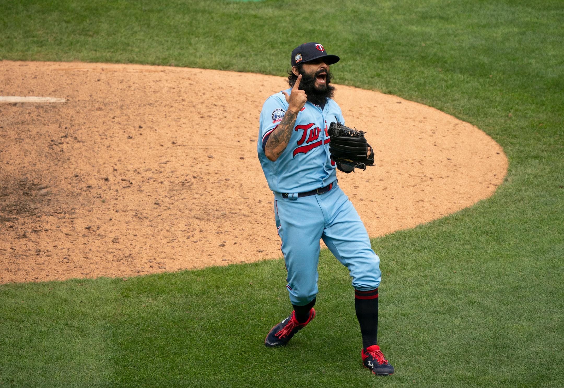 Minnesota Twins closer Sergio Romo (54) reacted after throwing the strike to Cleveland Indians first baseman Carlos Santana (41) that ended the game Sunday.