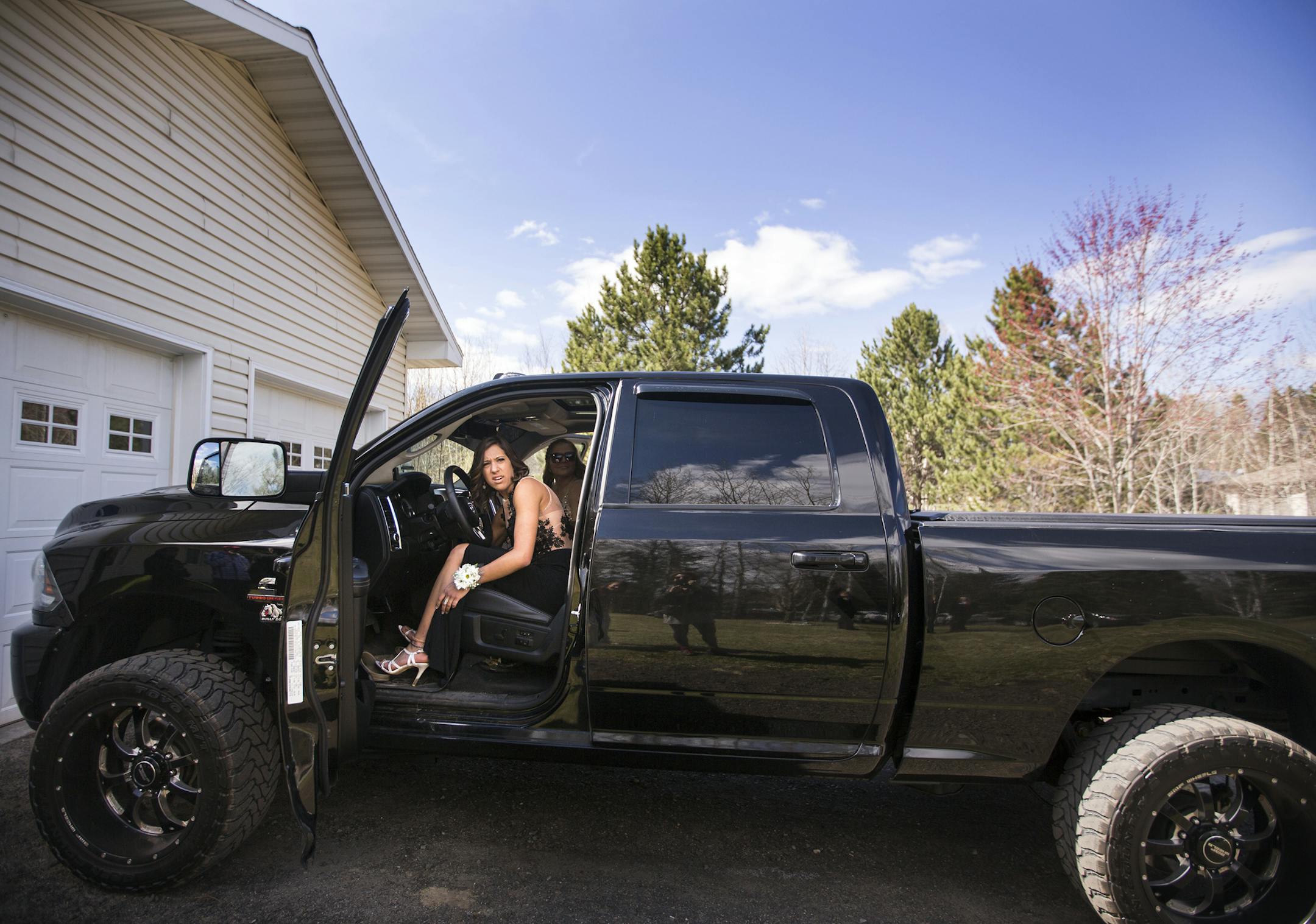 Baylee Hilfers borrows her older brother's truck to drive her friends to prom from her home in Fayal. ] (Leila Navidi/Star Tribune) leila.navidi@startribune.com BACKGROUND INFORMATION: Baylee Hilfers' father Todd works at U.S. Steel's Minntac taconite pellet plant and her brother is currently laid off from United Taconite mine. Feeling the financial pinch from their families, the girls have forgone big graduations gifts and parties, and prom dresses have been purchased this year from a discount