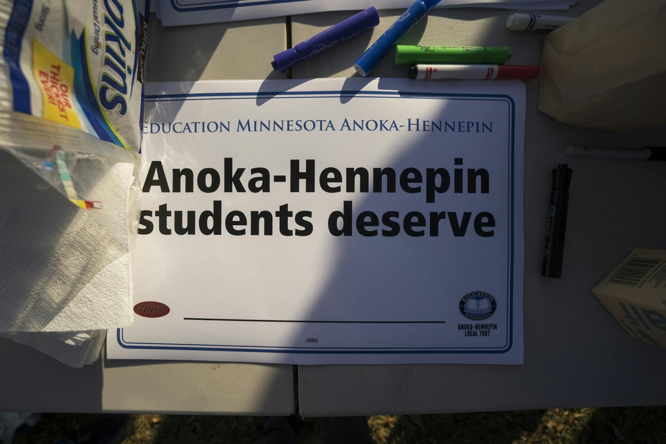 Signs for supporters to fill out sit on a table on Thursday, April 18, 2018 outside of Ramsey Elementary School in Ramsey, Minn.