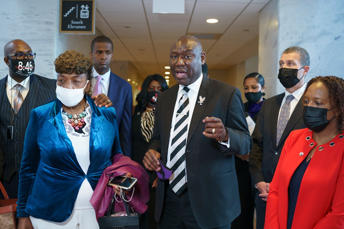 Civil rights attorney Ben Crump, who represented the George Floyd family, is joined by family members of victims of racial injustice following a meeting with Sen. Tim Scott, R-S.C., who is working on a police reform bill in the Senate, at the Capitol in Washington, Thursday, April 29, 2021. At left are Philonise Floyd, brother of George Floyd who was killed by Minneapolis police during an arrest, and Gwen Carr, mother of Eric Garner who was killed by a New York Police Department officer using a prohibited chokehold during his arrest. (AP Photo/J. Scott Applewhite)