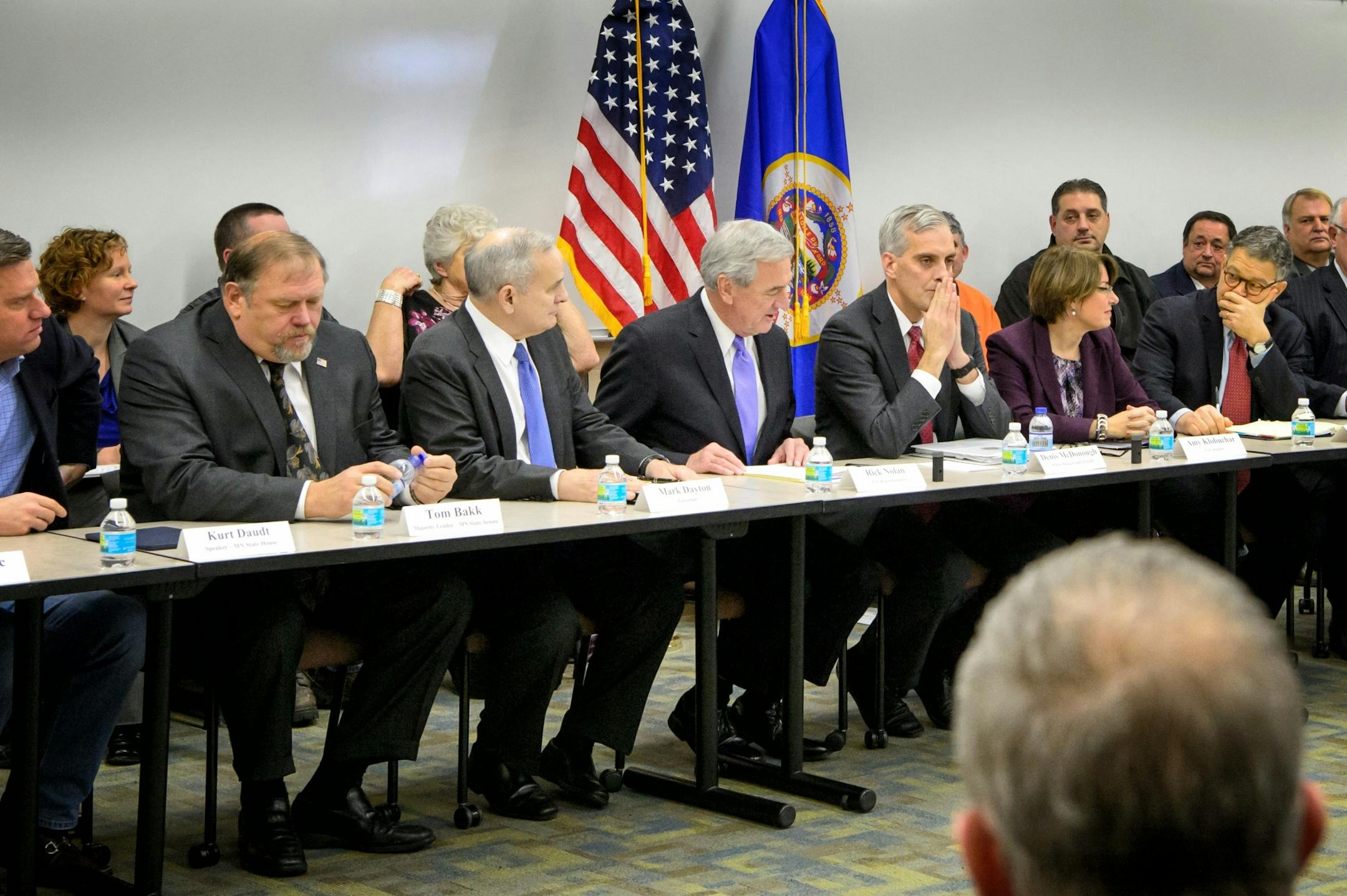 White House chief of staff Denis McDonough, center, waited for the meeting to start. From left, House Speaker Kurt Daudt, Senate Majority Leader Tom Bakk, Governor Mark Dayton, U.S. Rep. Rick Nolan, McDonough, Senators Amy Klobuchar and Al Franken.