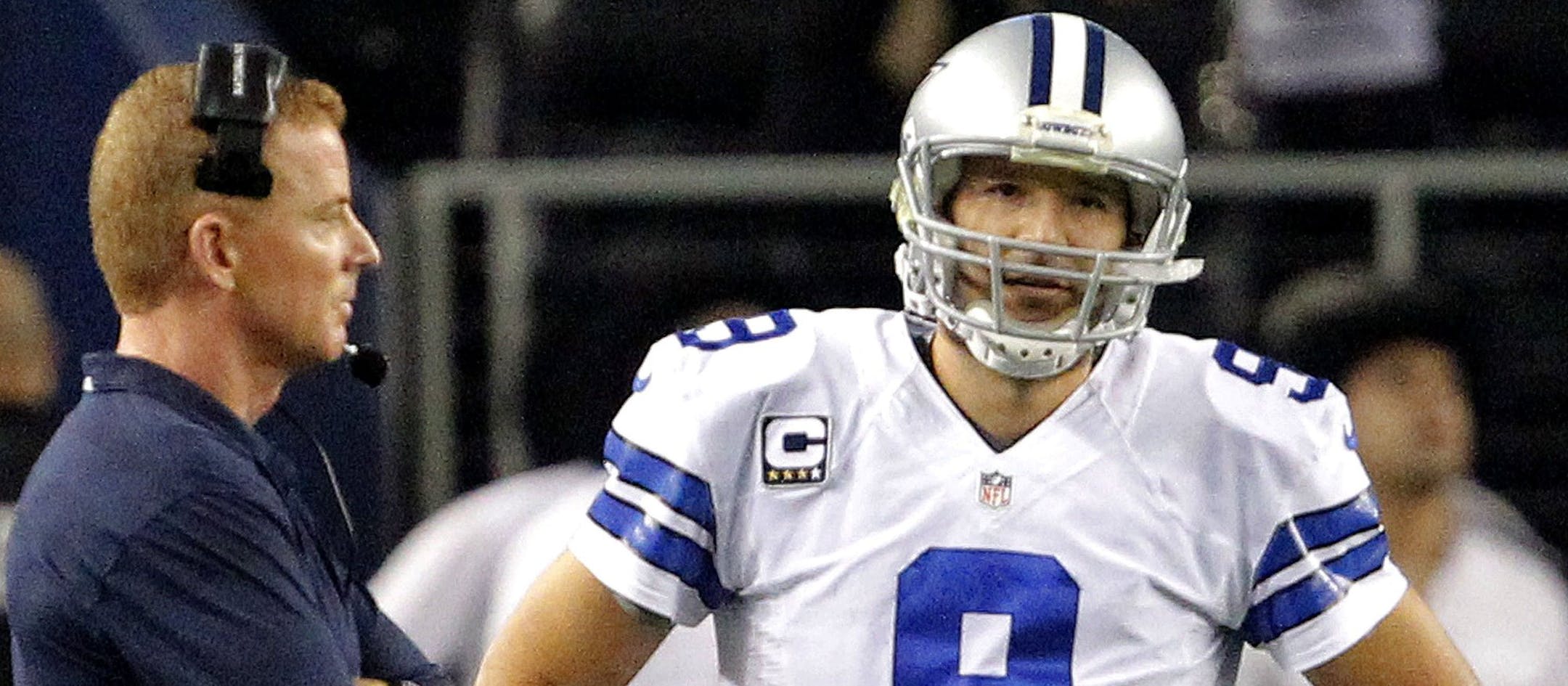 Dallas Cowboys head coach Jason Garrett and quarterback Tony Romo (9) after Romo threw a second fourth-quarter interception against the Green Bay Packers at AT&T Stadium in Arlington, Texas, on Sunday, Dec. 15, 2013. (Ron Jenkins/Fort Worth Star-Telegram/MCT)