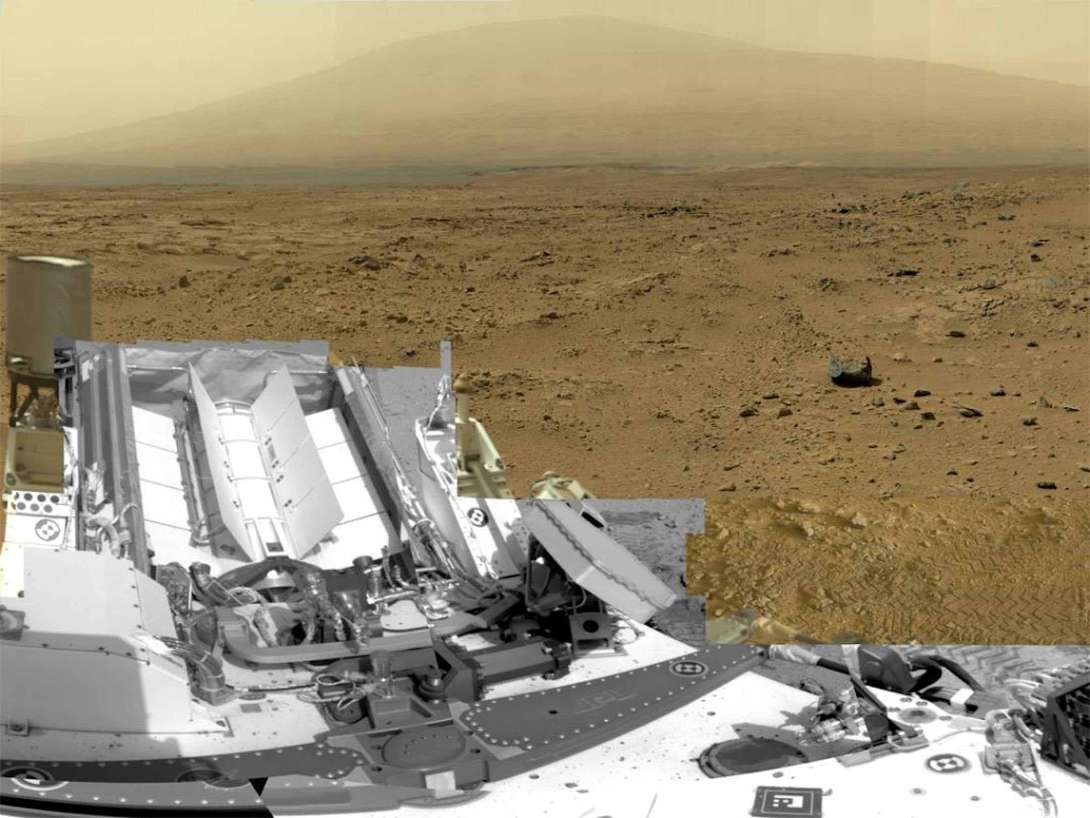 This photo released by NASA shows a photo stitched together from nearly 900 images taken by the NASA rover Curiosity showing a section of Gale Crater near the Martian equator. Nearly a year after landing, Curiosity is finally starting the drive to a mountain in search of the chemical building blocks of life.