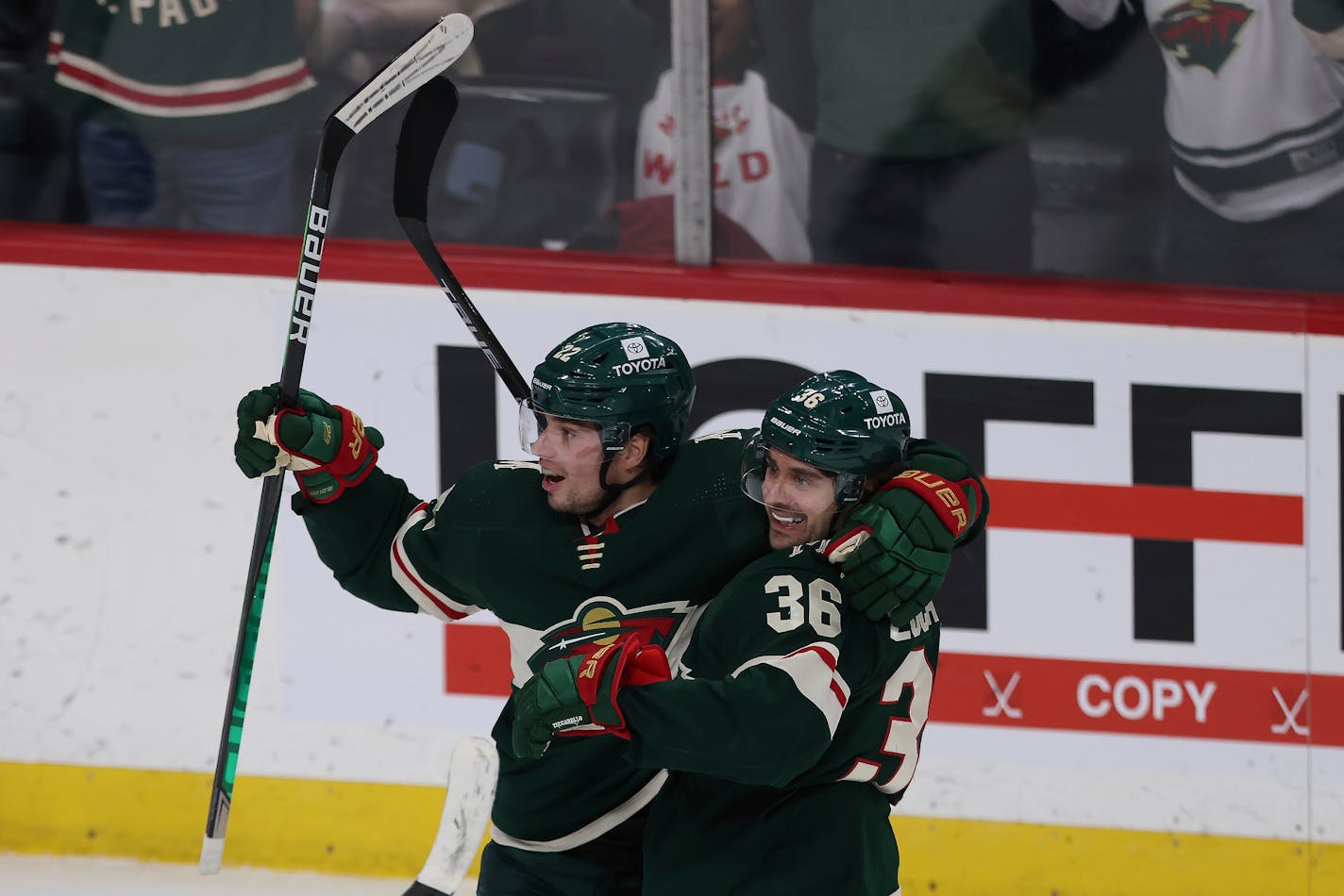 Minnesota Wild left wing Kevin Fiala (22) reacts with right wing Mats Zuccarello (36) after scoring the game winning goal in overtime against the Colorado Avalanche during an NHL hockey game Sunday, March 27, 2022, in St. Paul, Minn. Minnesota won 3-2 in overtime. (AP Photo/Stacy Bengs)