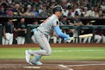 Twins third baseman Royce Lewis swings during a game at Arizona last week. Now he's on the injured list for the second time this season, a development