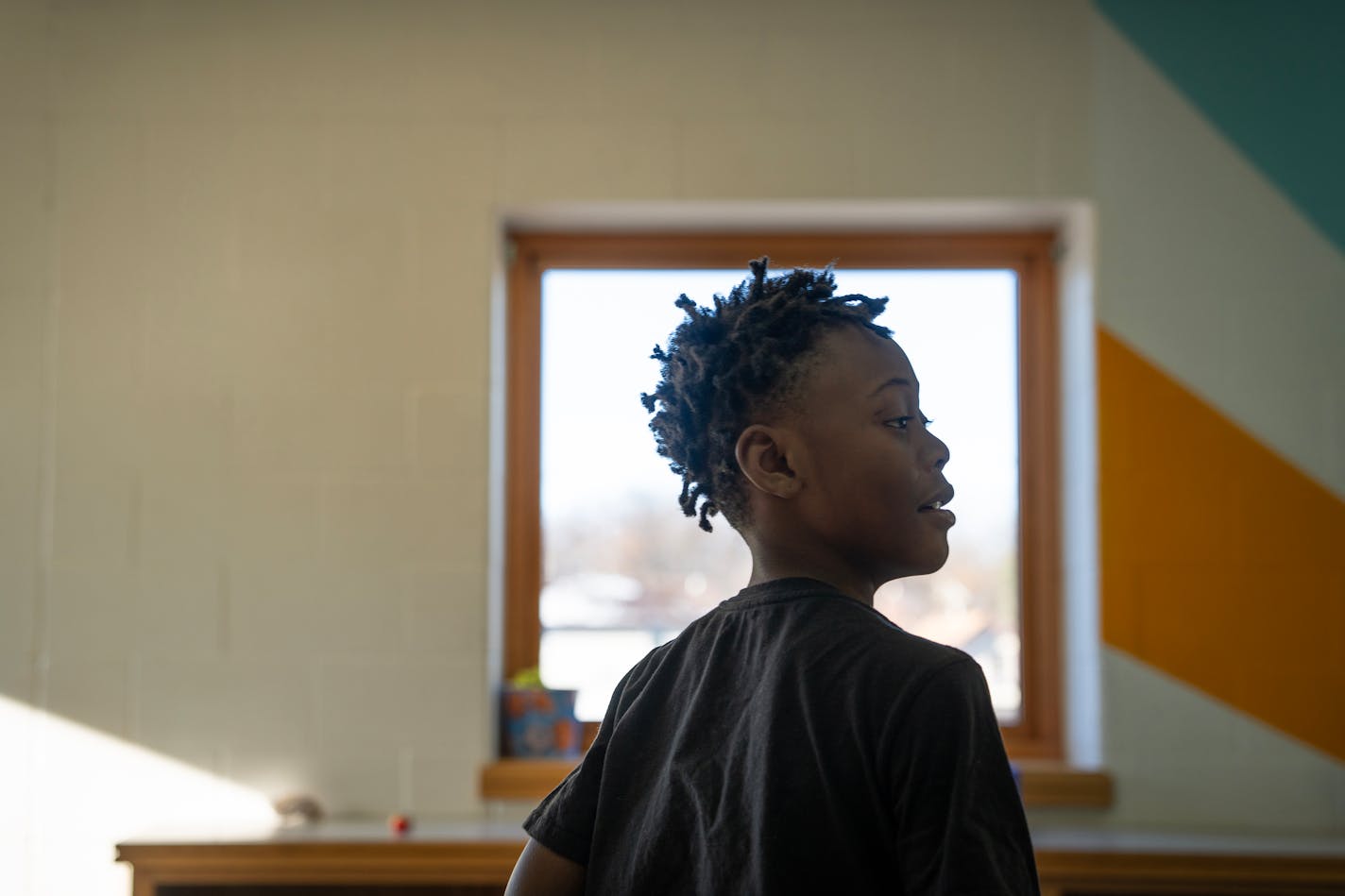 De'sean Davis, second grader at Nellie Stone Johnson Elementary, burns off energy by playing catch with Erin Crosby, support staff member, inside the 'sensory room' during the school day in Minneapolis, Minn., on Wednesday, Dec. 13, 2023.