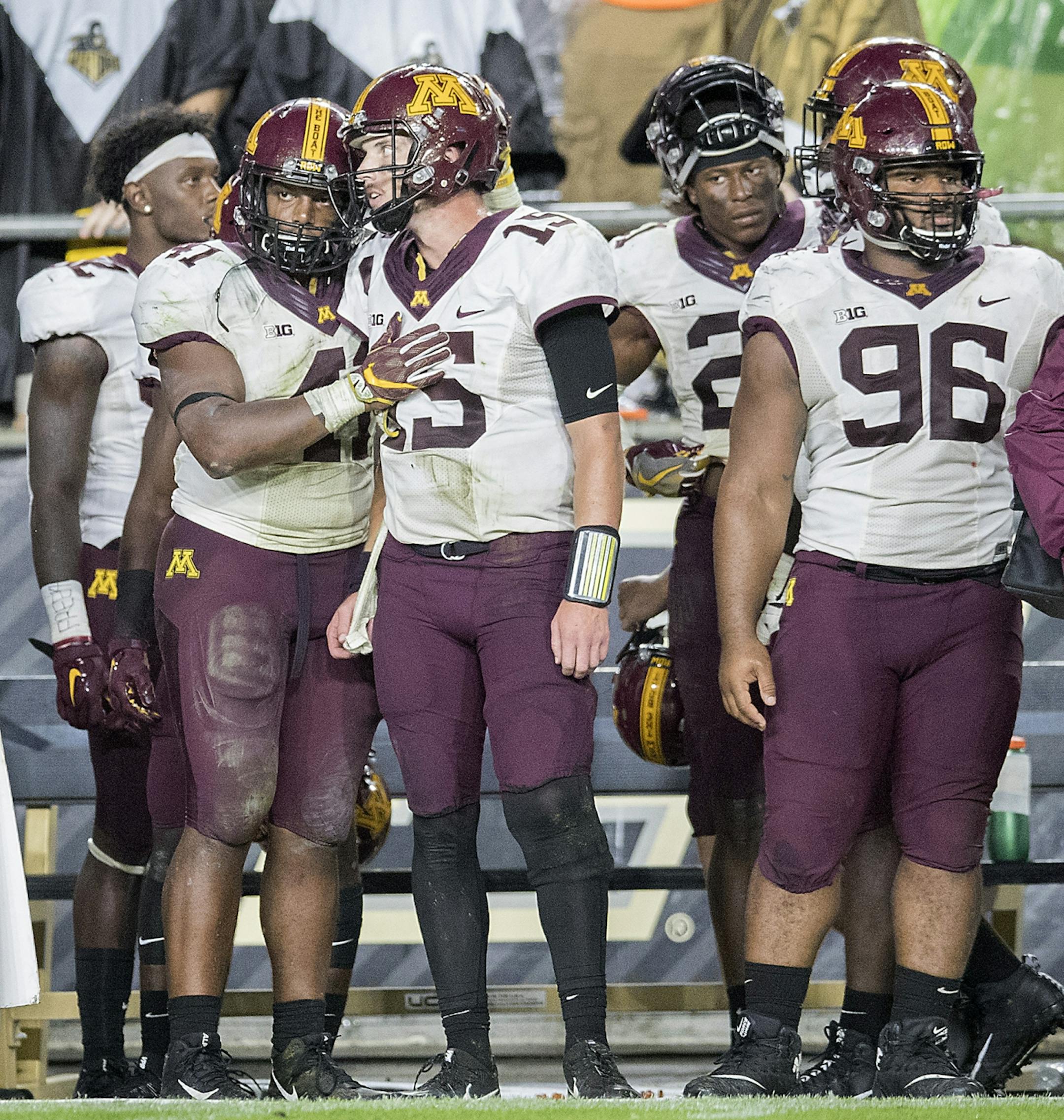 Minnesota's quarterback Conor Rhoda is comforted by teammates as Purdue clinched a 31-17 win over the Gophers at Ross�Ade Stadium, Saturday, October 7, 2017 in West Lafayette, IN.