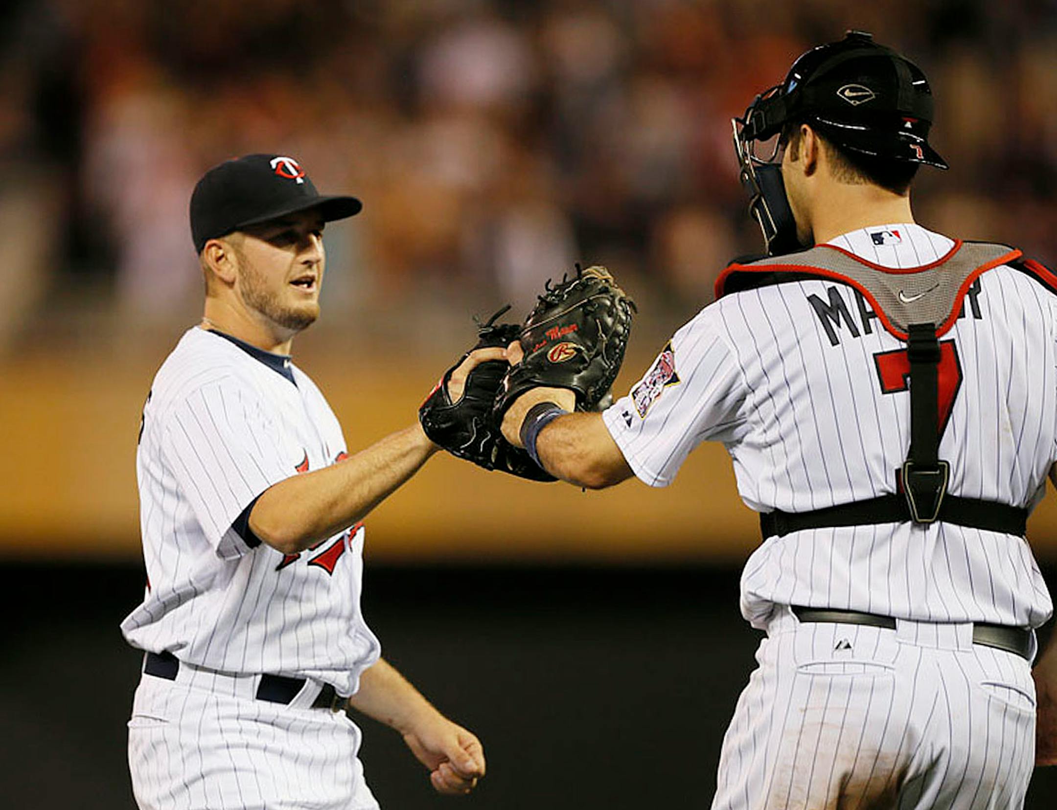 Twins closer, Glen Perkins and Joe Mauer celebrated their win against the Phillies at Target Field